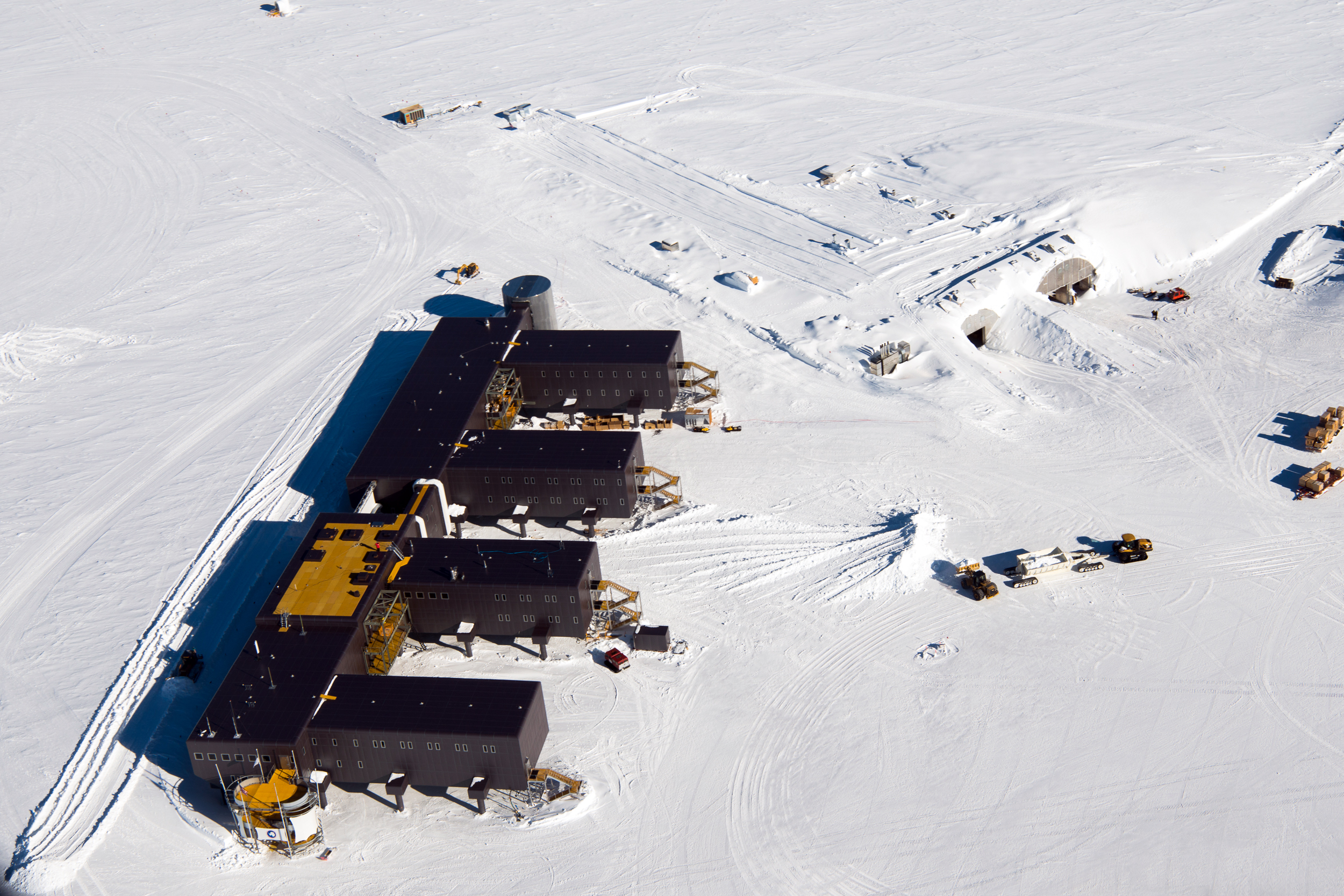 Aerial view of a large building on snow.