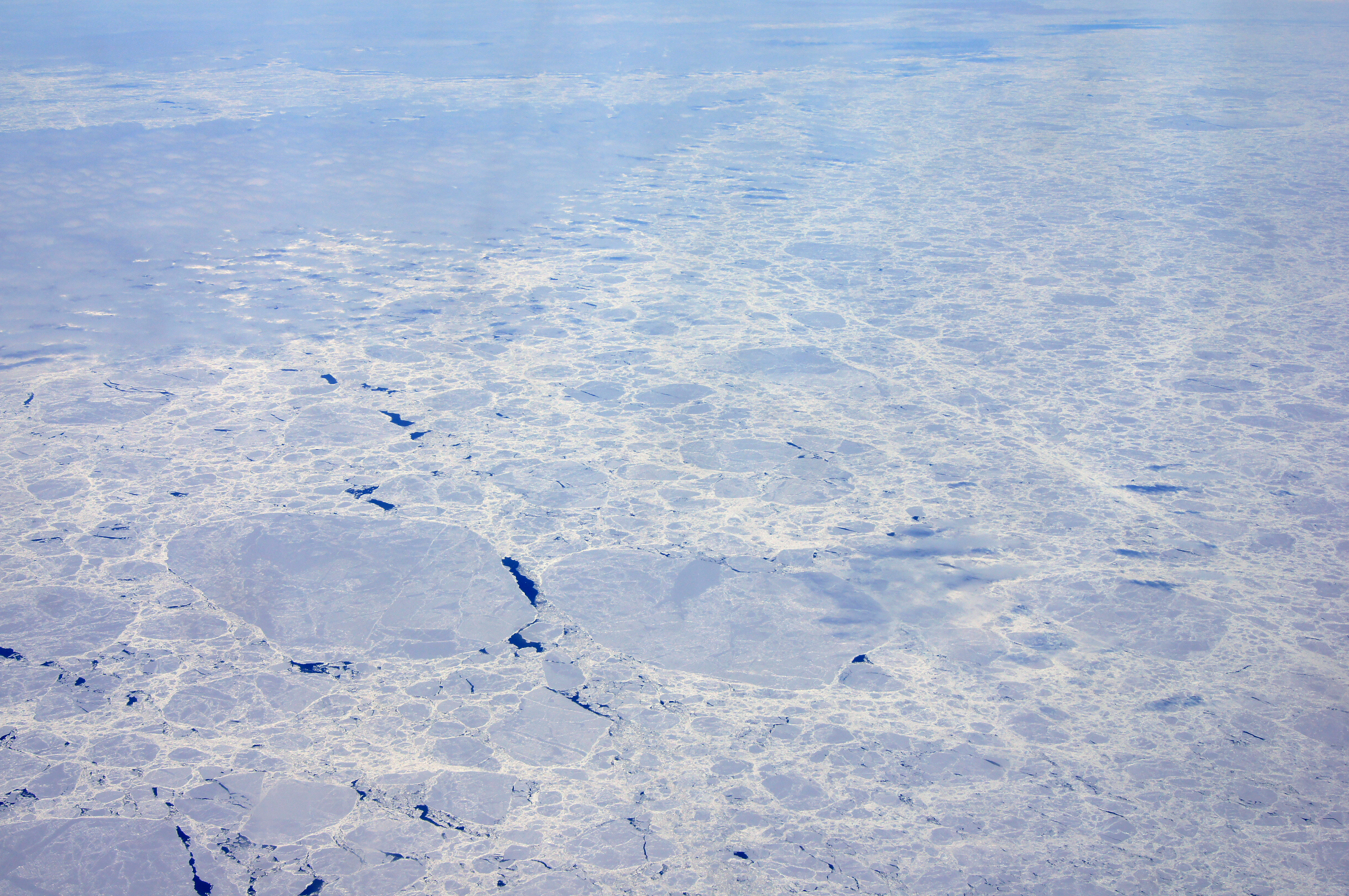 Aerial view of ice-covered water.