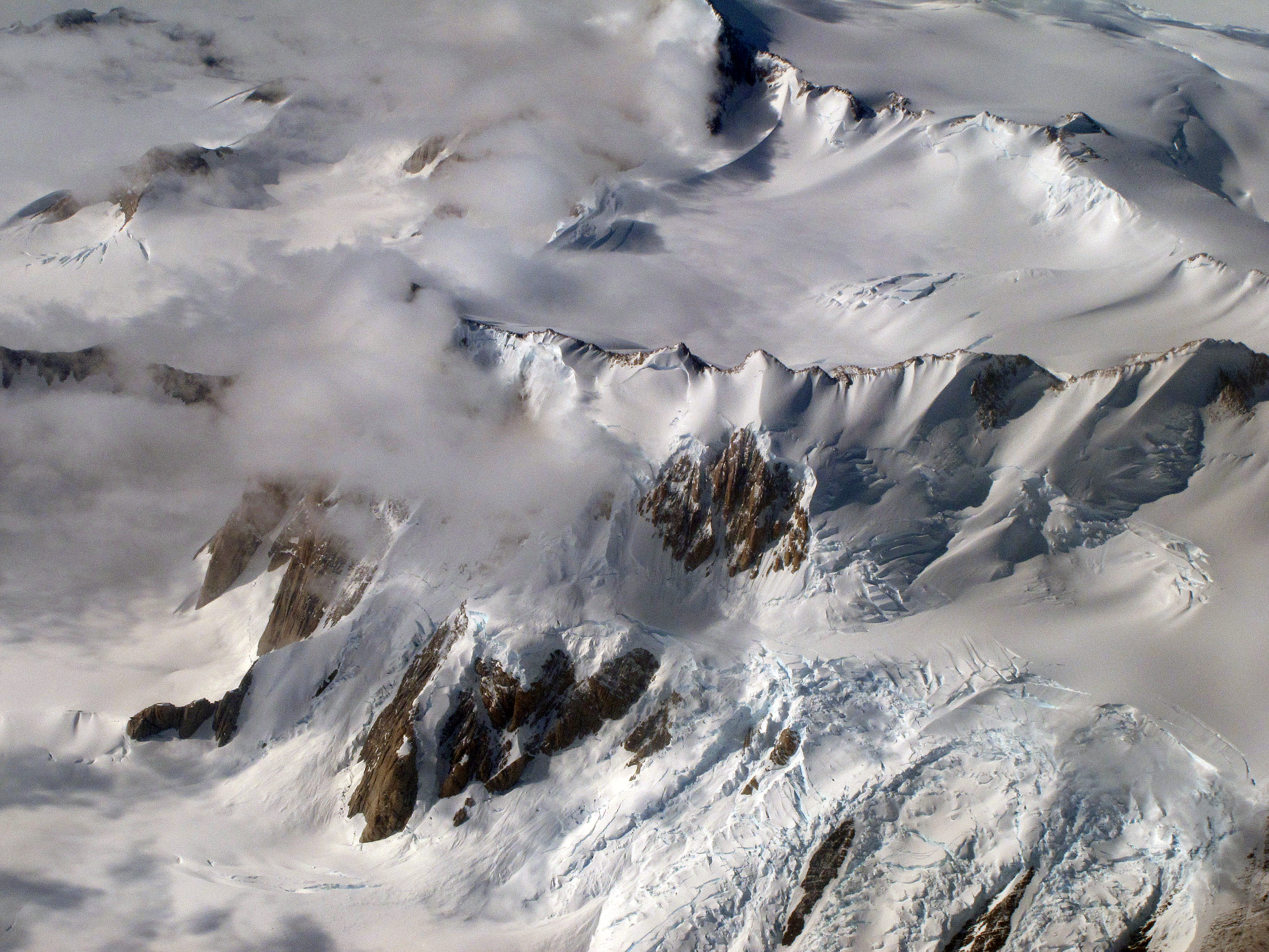 Aerial view of snow covered mountains.