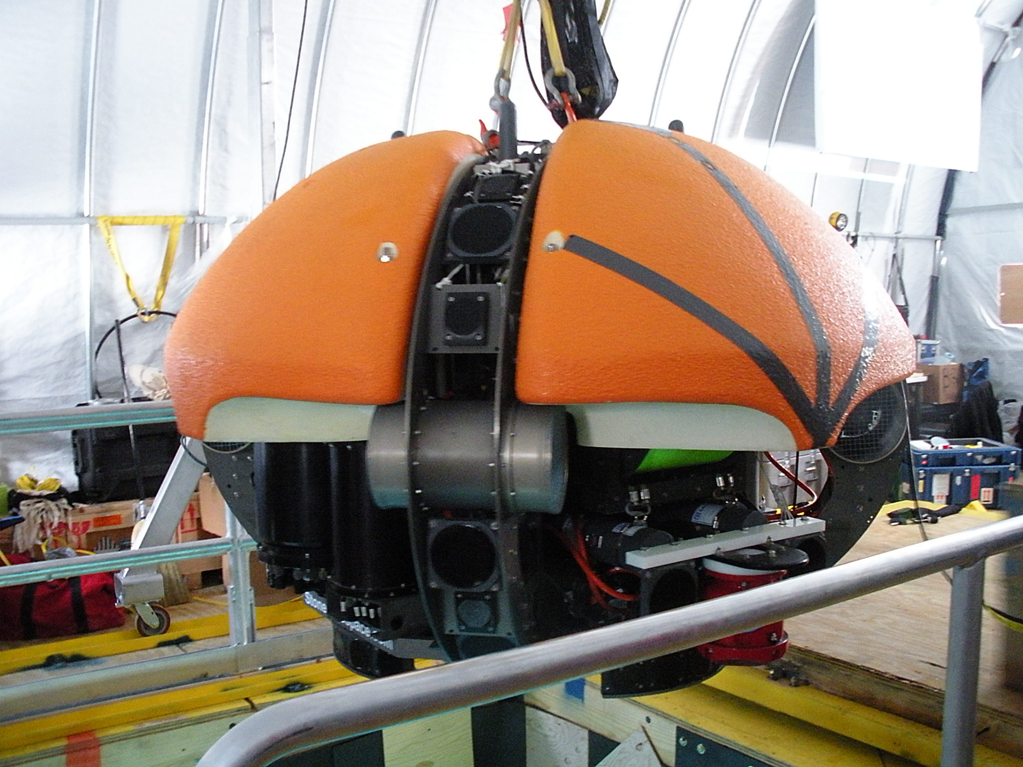 An orange robotic machine.