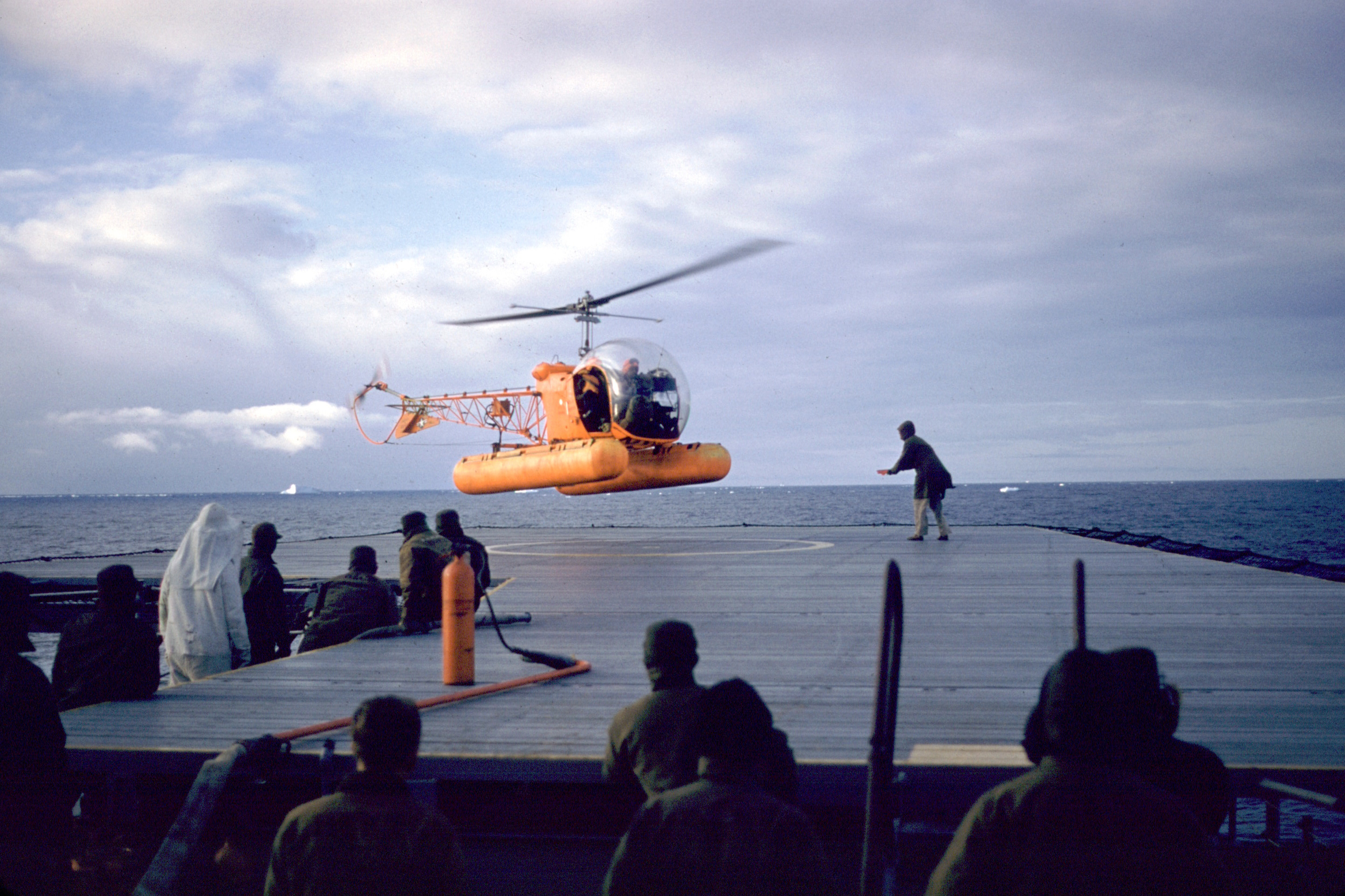 Helicopter lands on ship.