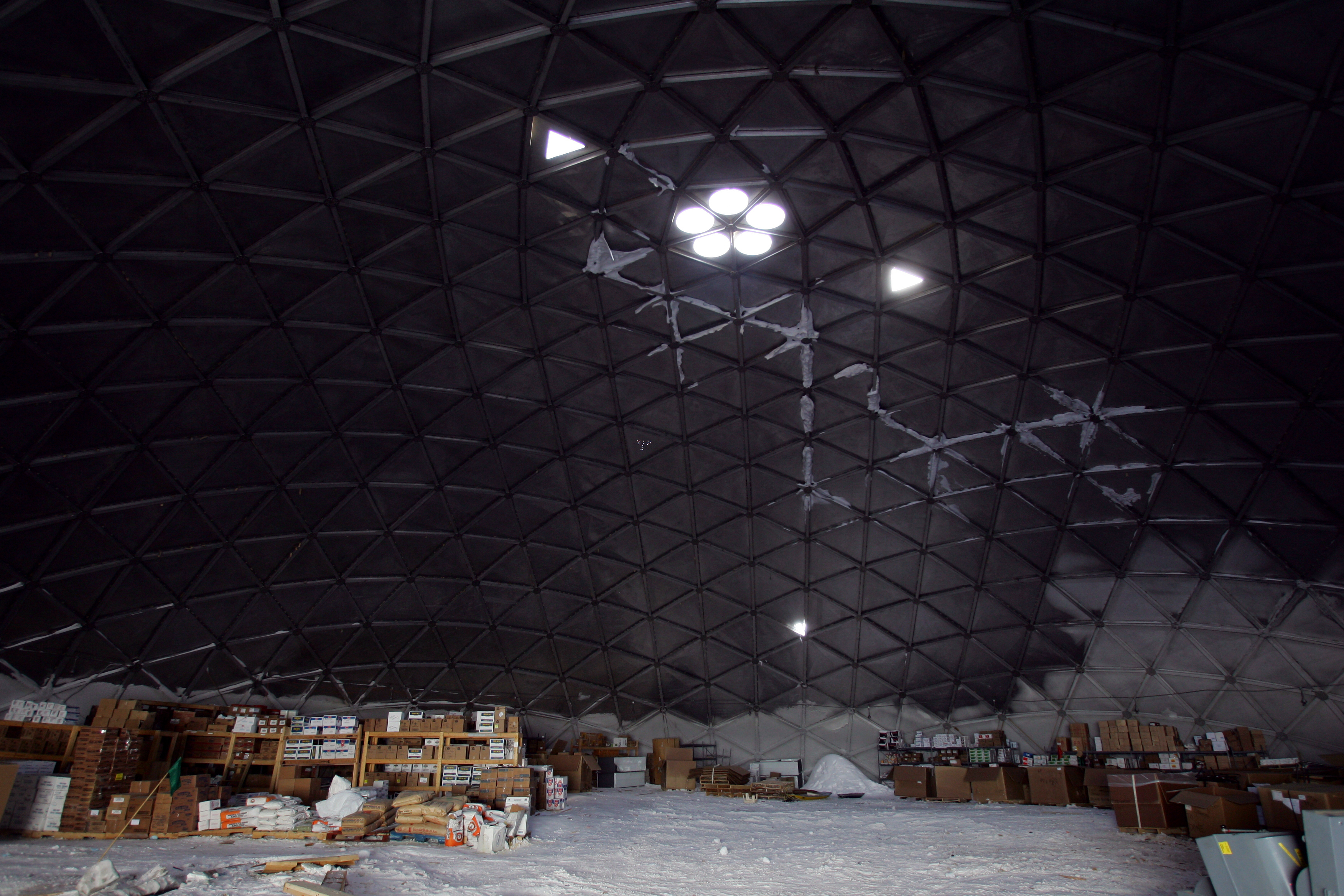 Cargo pallets under a domed roof.