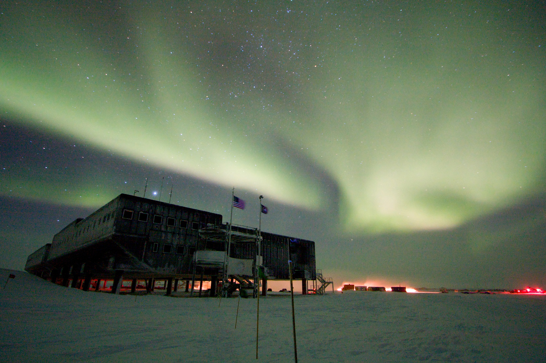 An aurora covers the sky over the U.S. research station at the South Pole. 