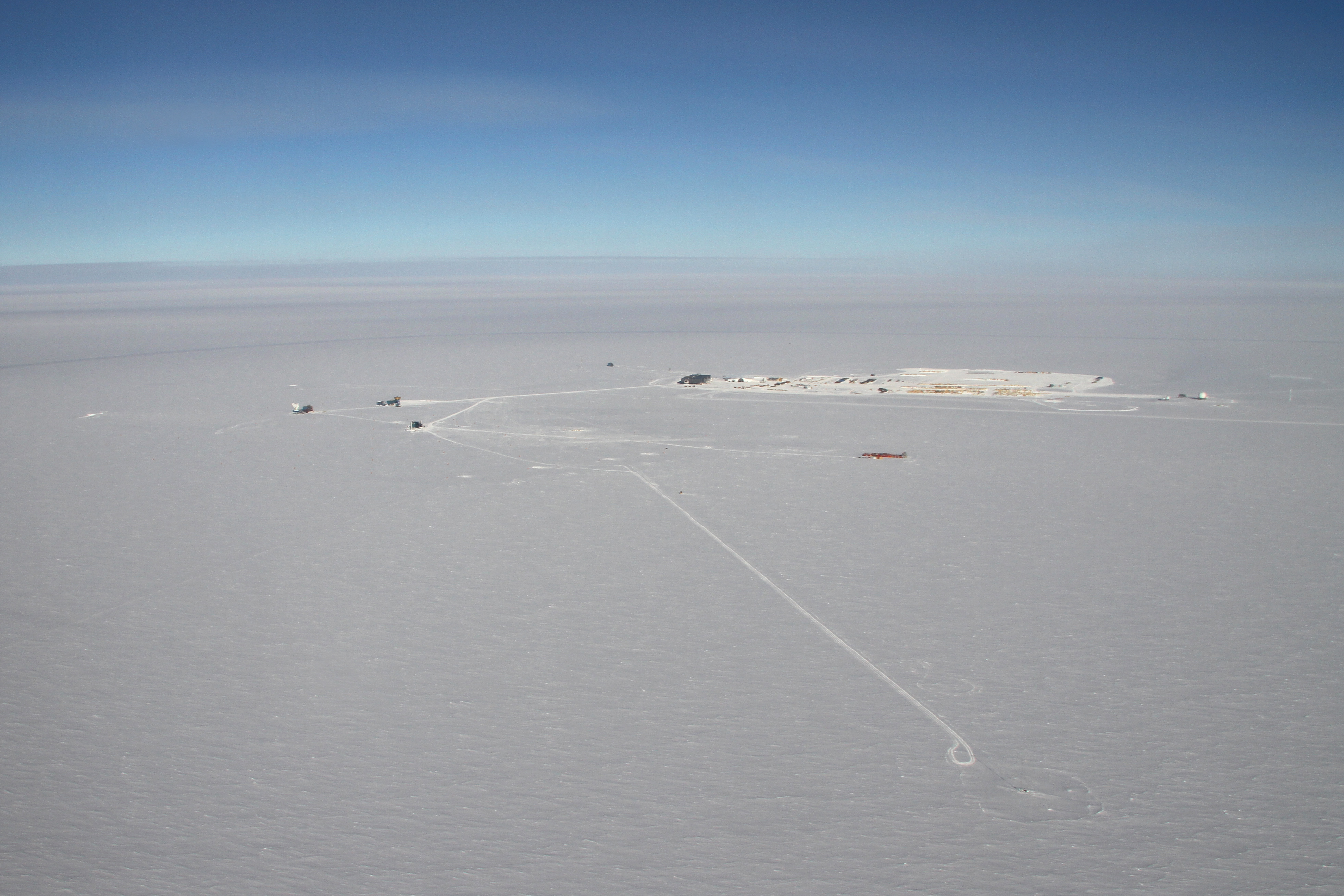 Aerial photo of buildings on snow.