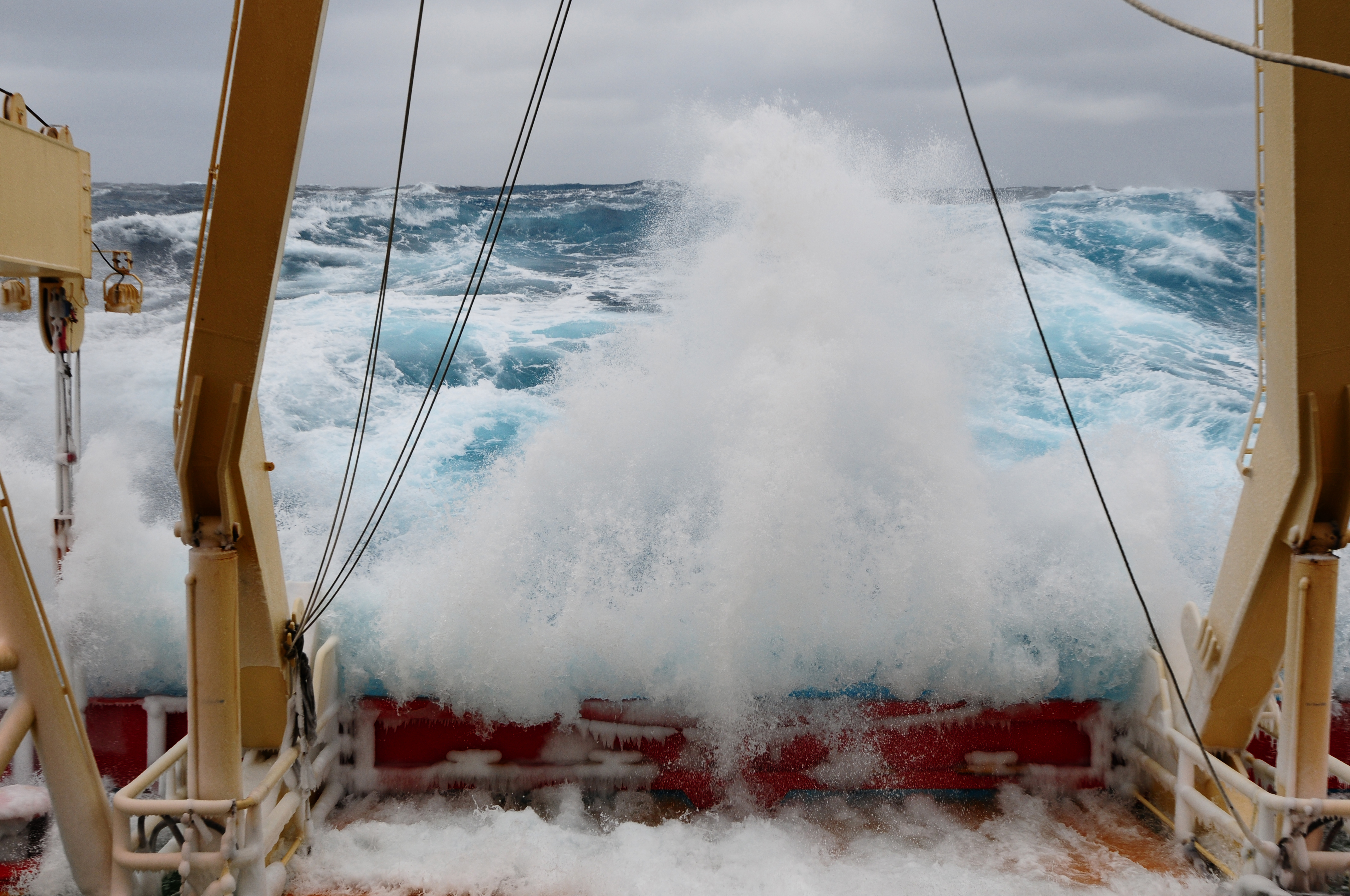 Ocean water rolling over a ship deck.