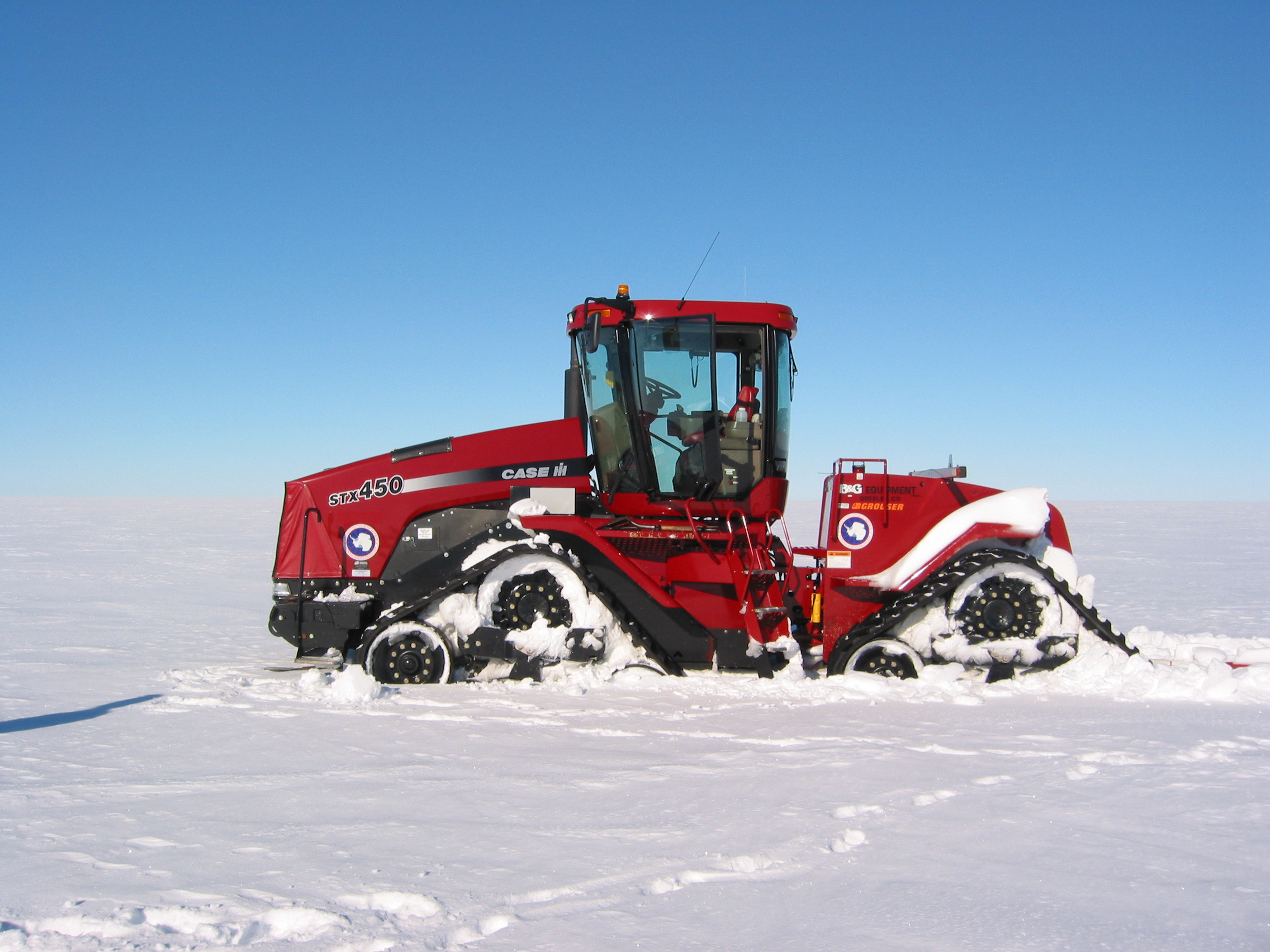 A tractor on snow.
