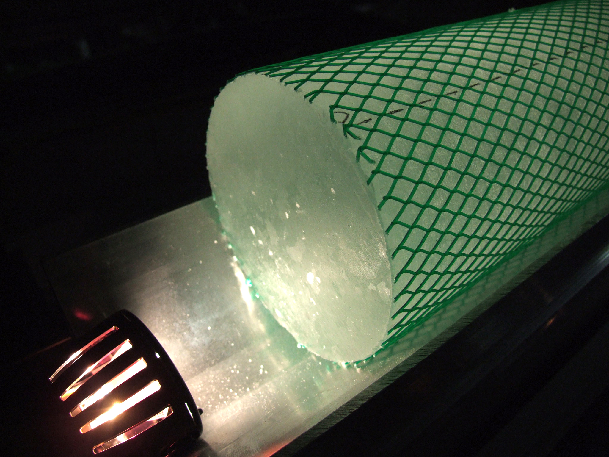 Green net covers an ice core.