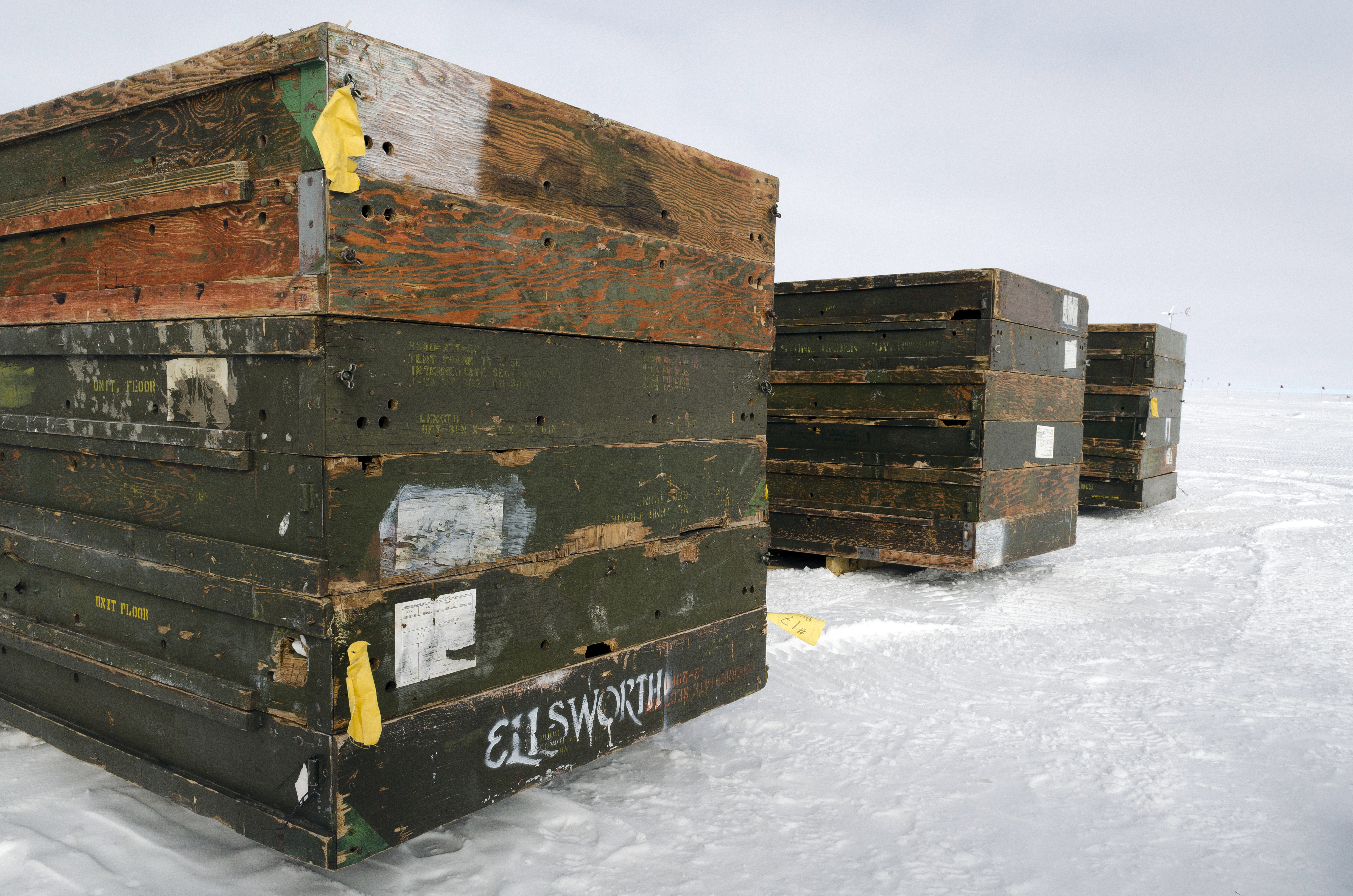 Stacks of pallets sits on snow.