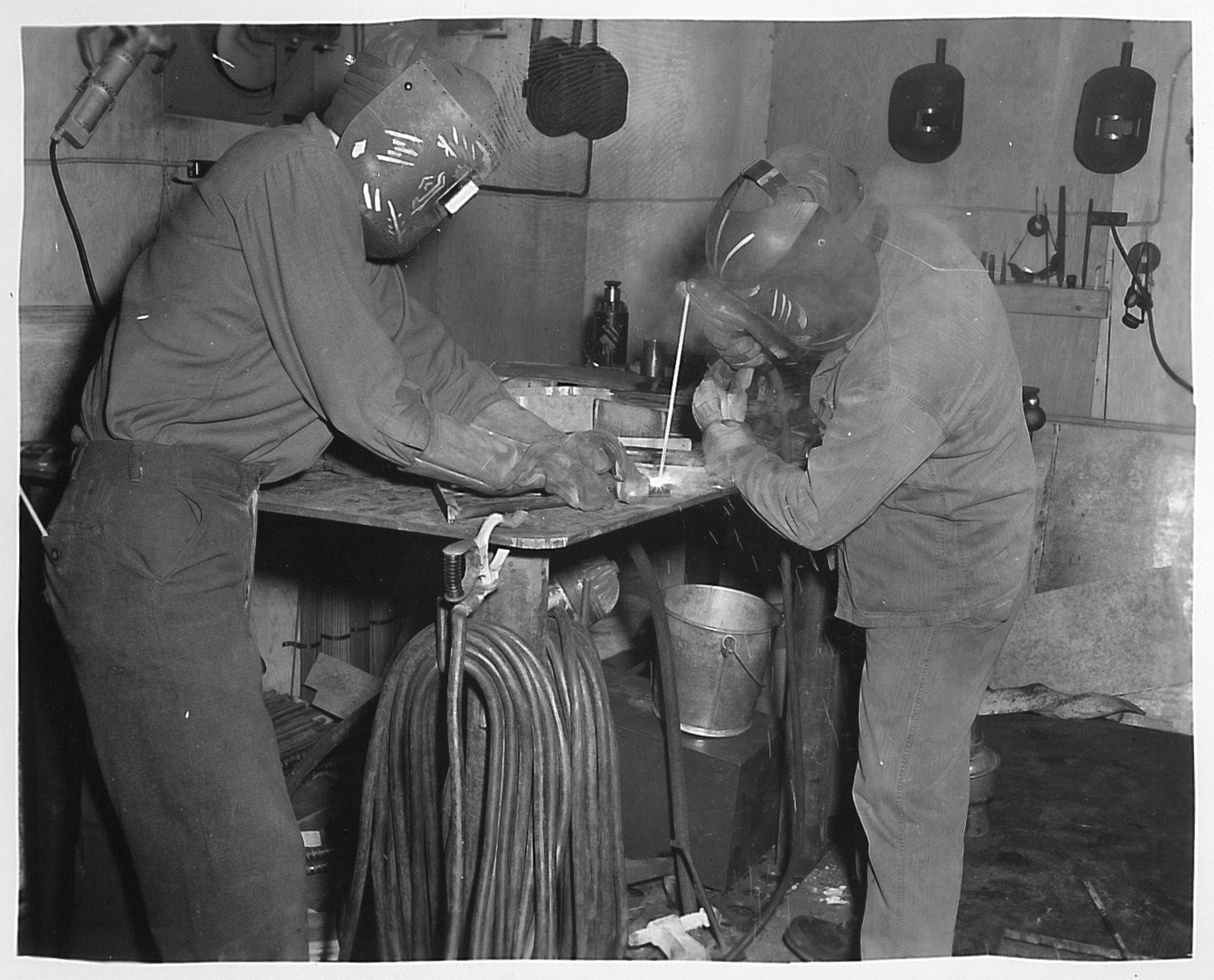 Two welders working.