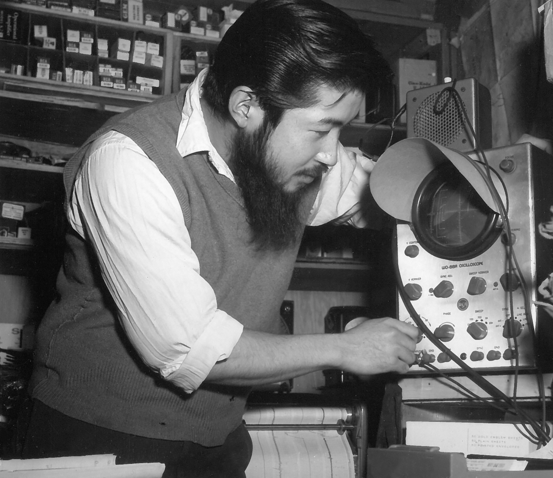 1960 photo of a man operating science equipment.
