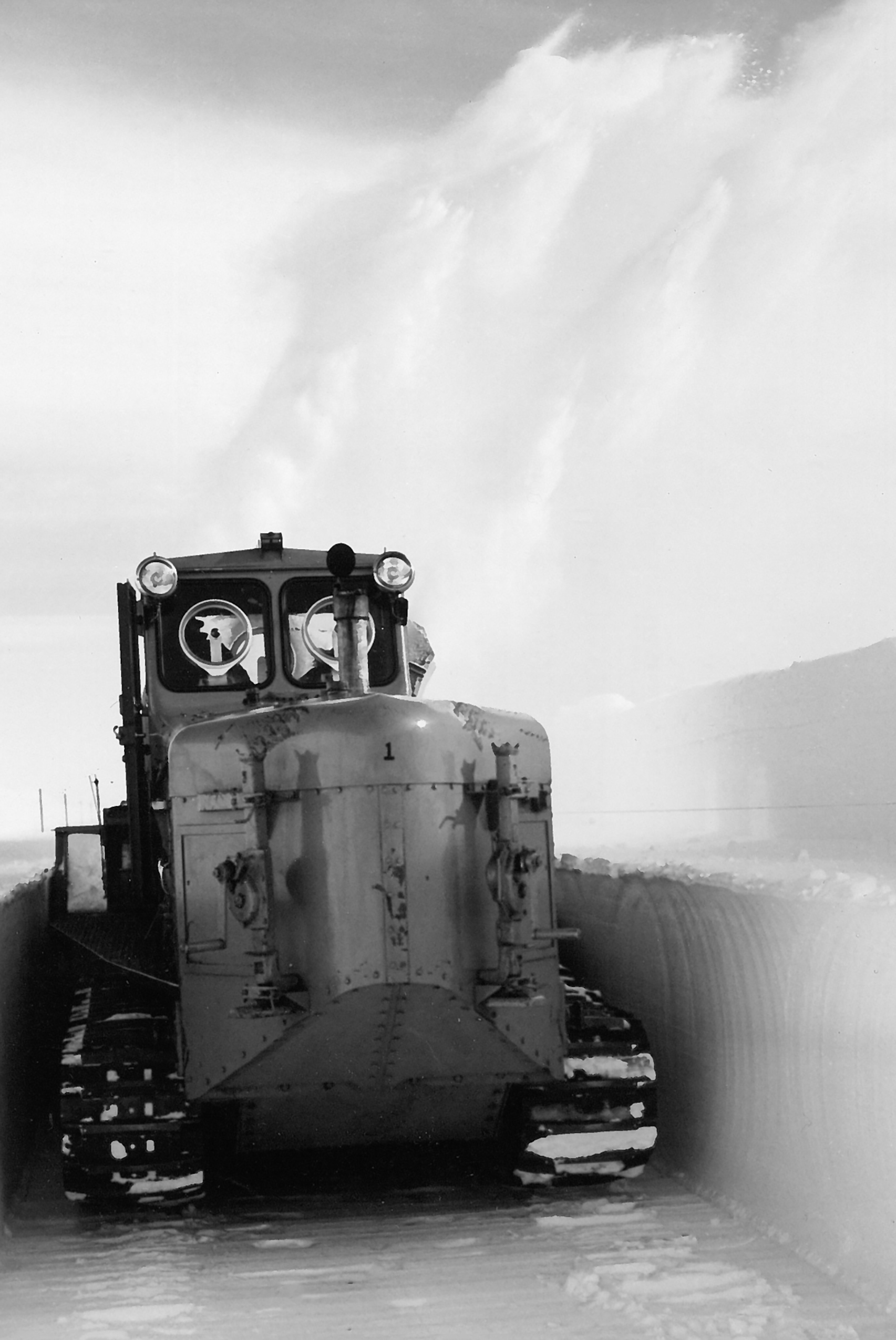 1960 photo of a tractor in an ice tunnel.
