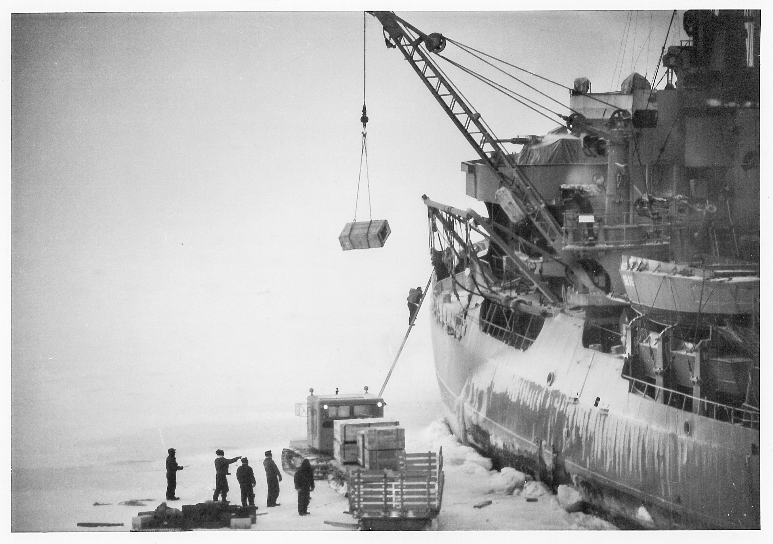 Cargo is unloaded from a ship.