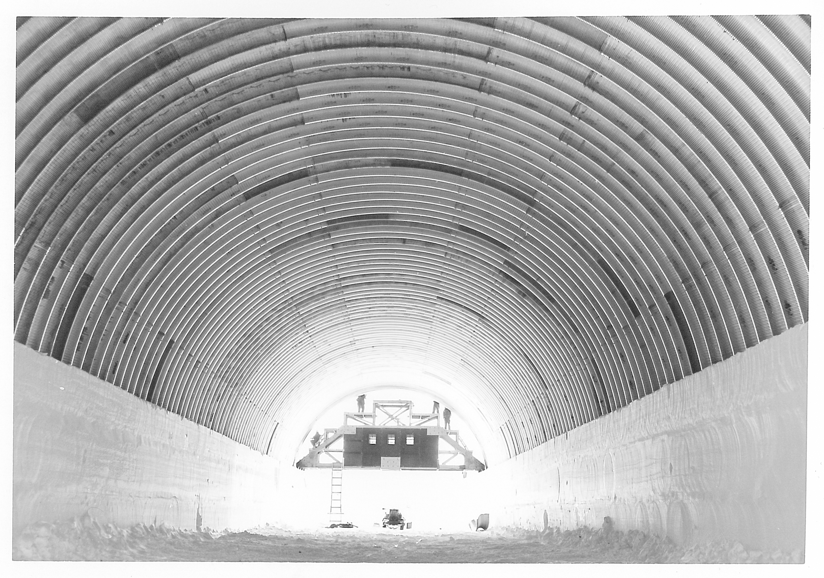 The view inside a long arched tunnel.