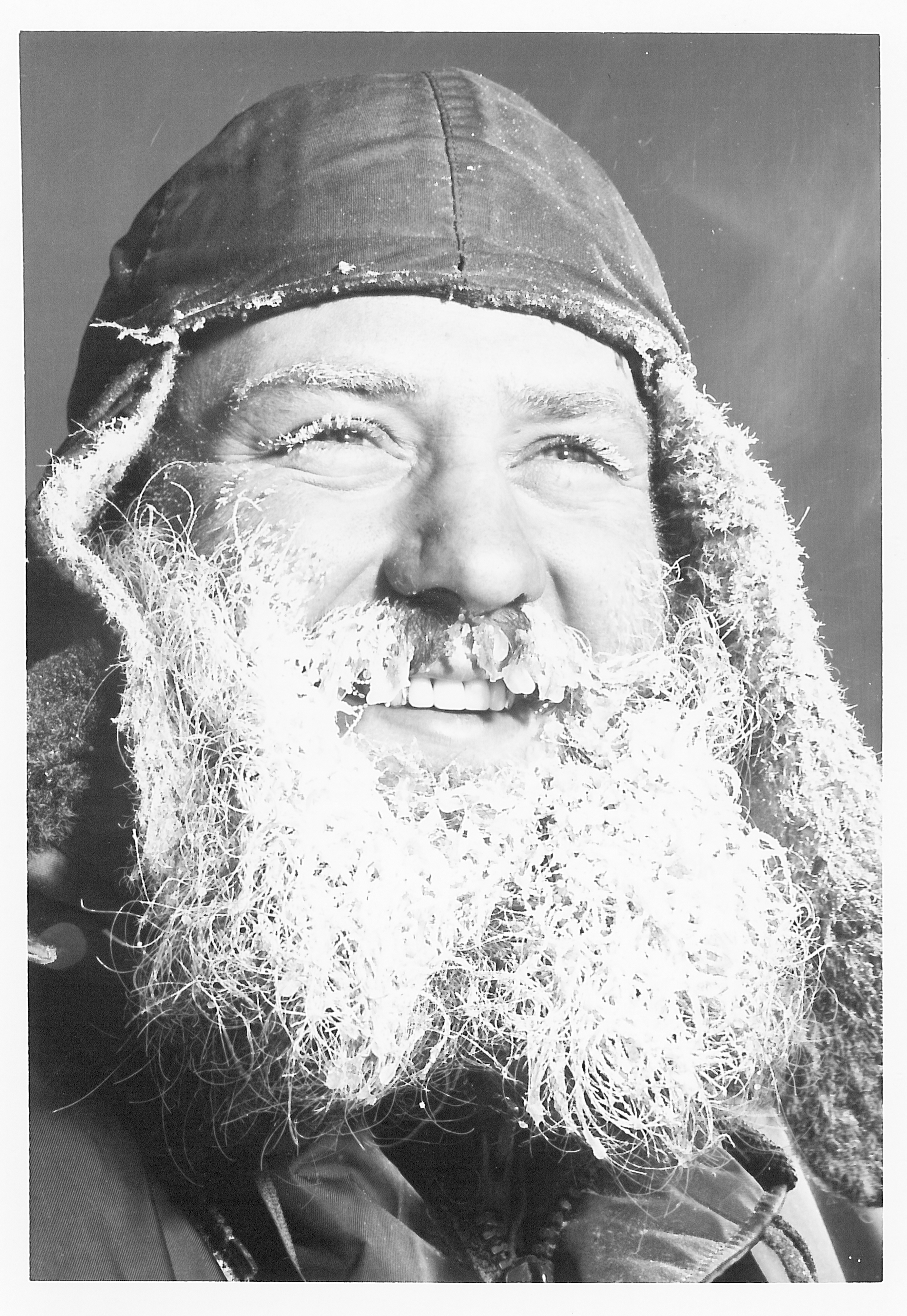 A portrait of a man with frost on his beard.