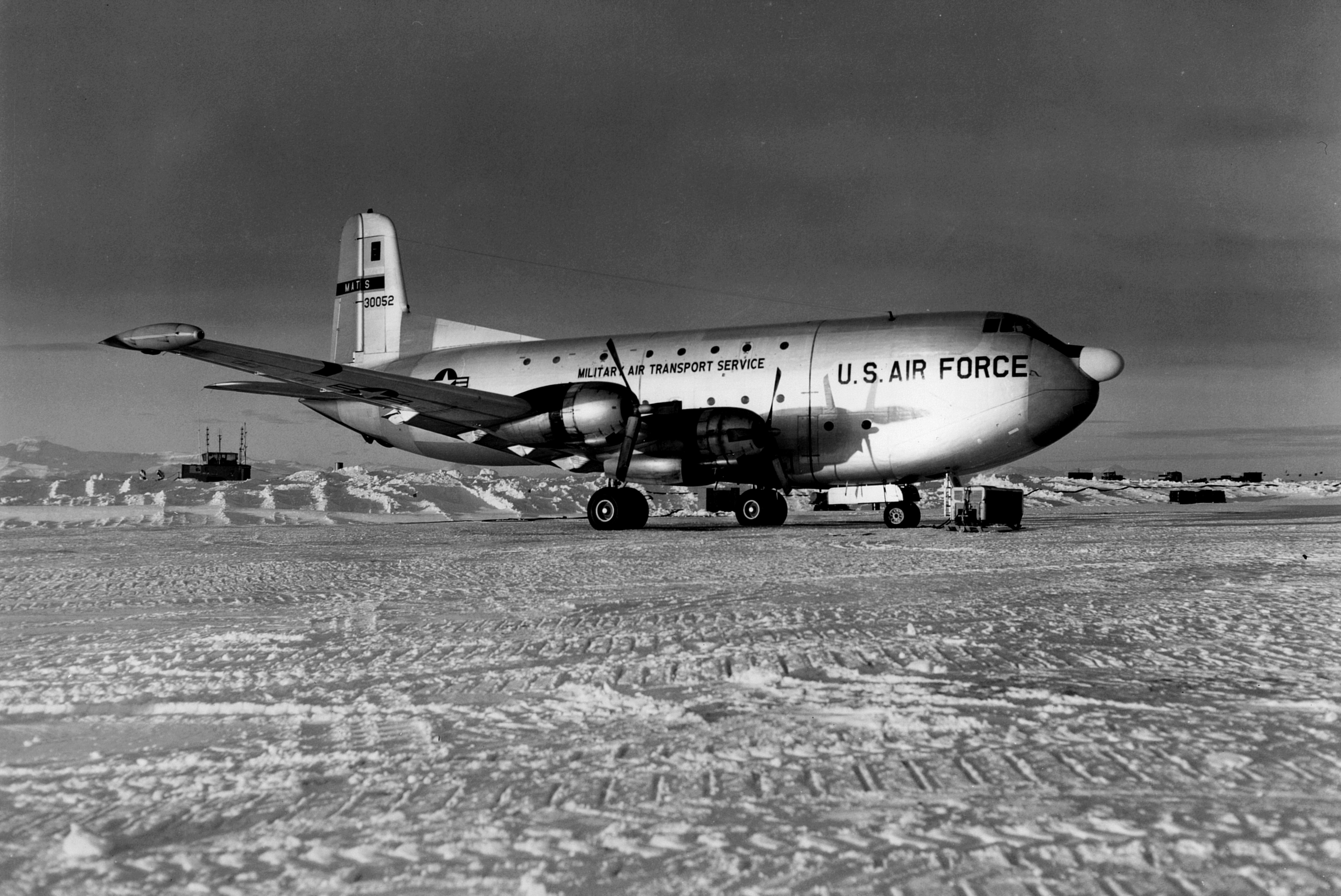 A U.S. Air Force airplane parked on snow.