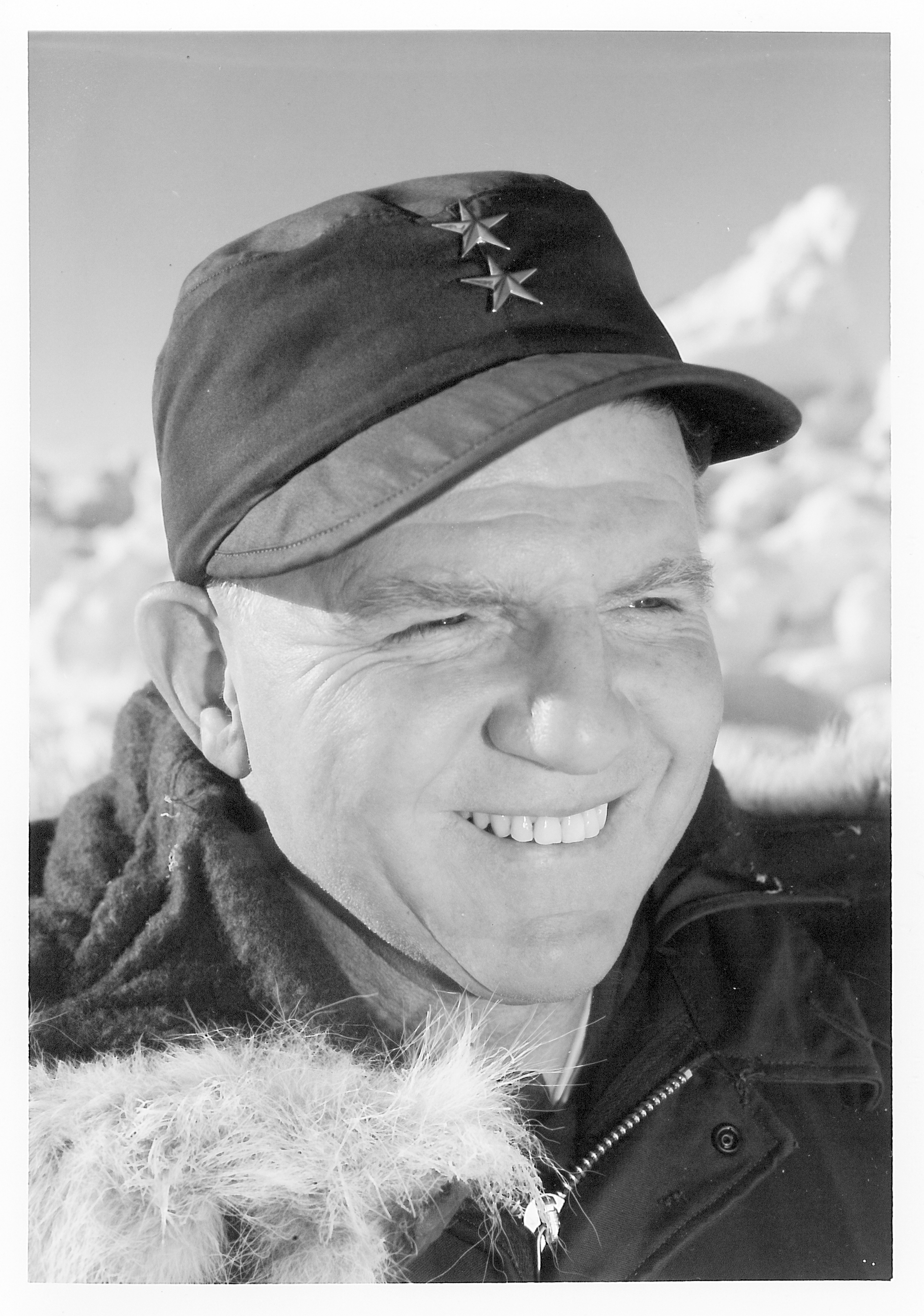 A portrait of a man outside in the snow.