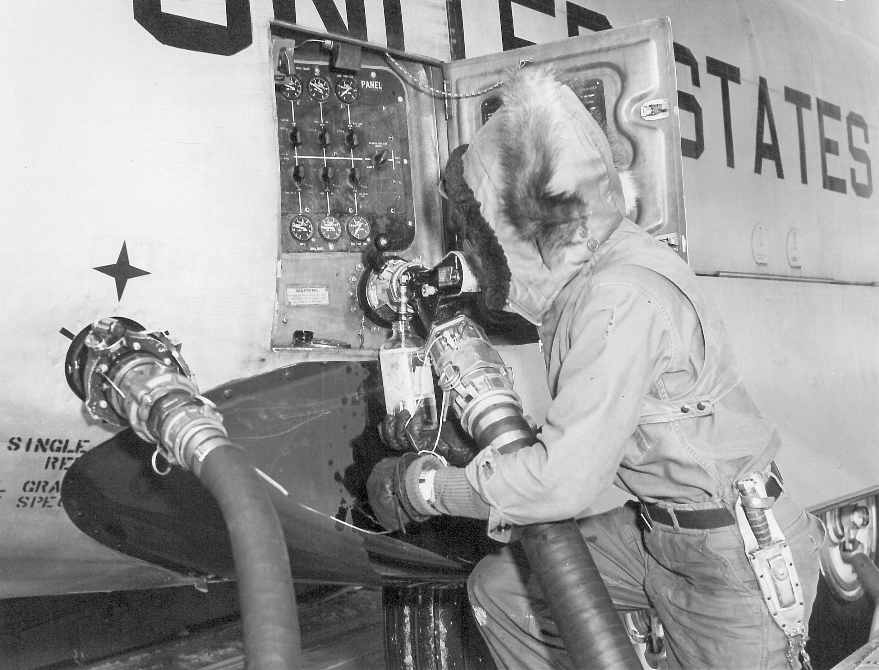 A man fueling an airplane.