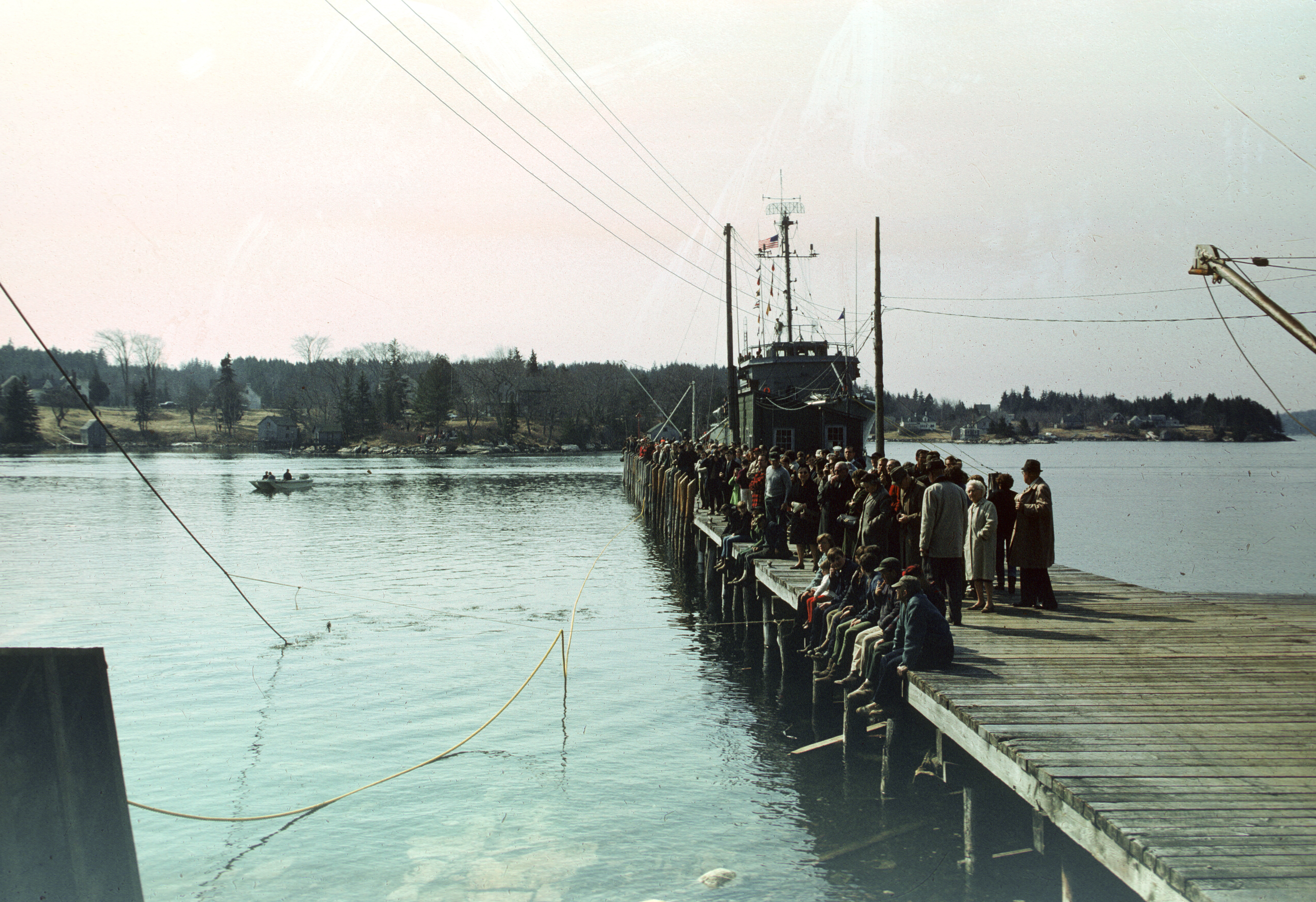 People gathered on a dock.