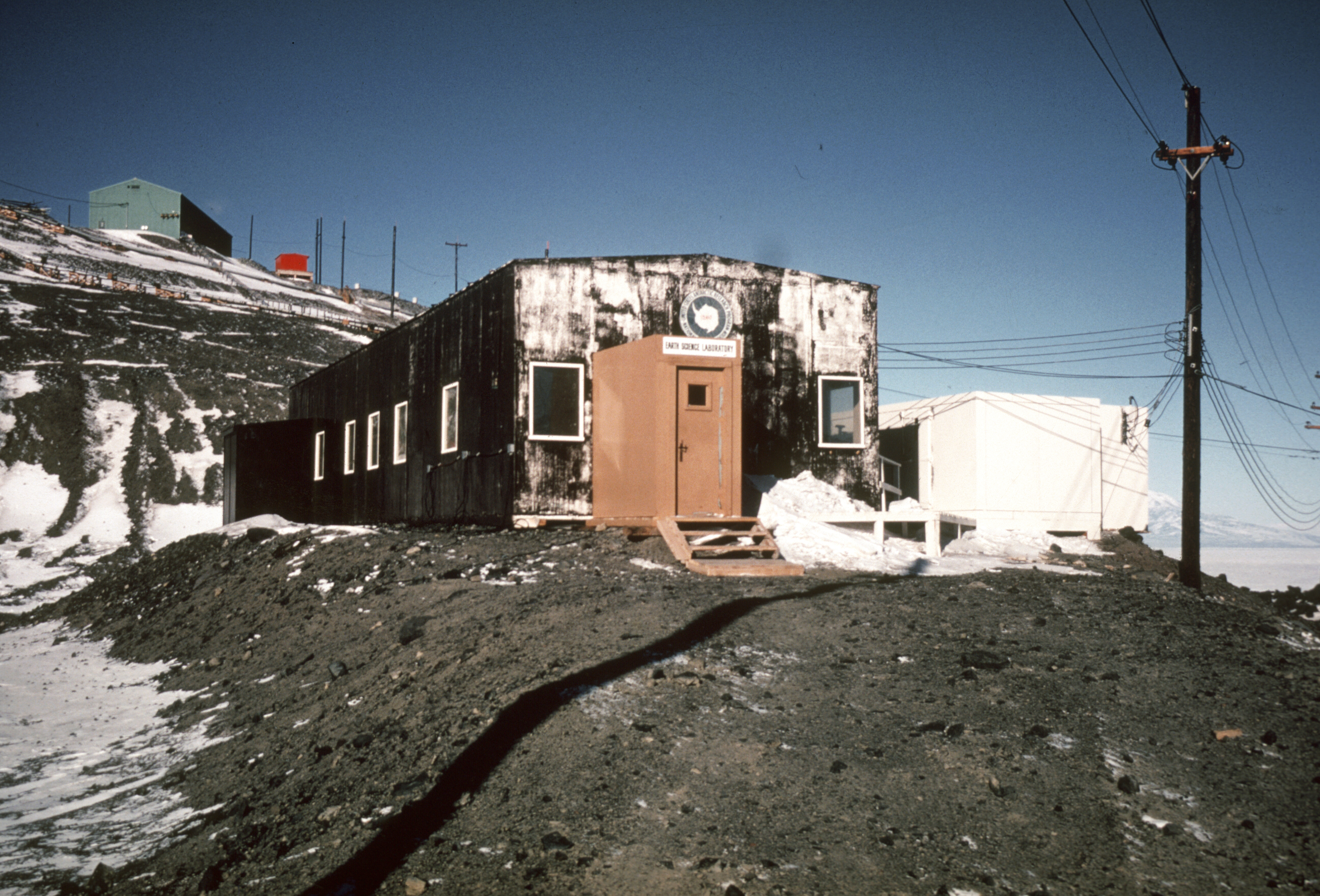 A small building on a hill.