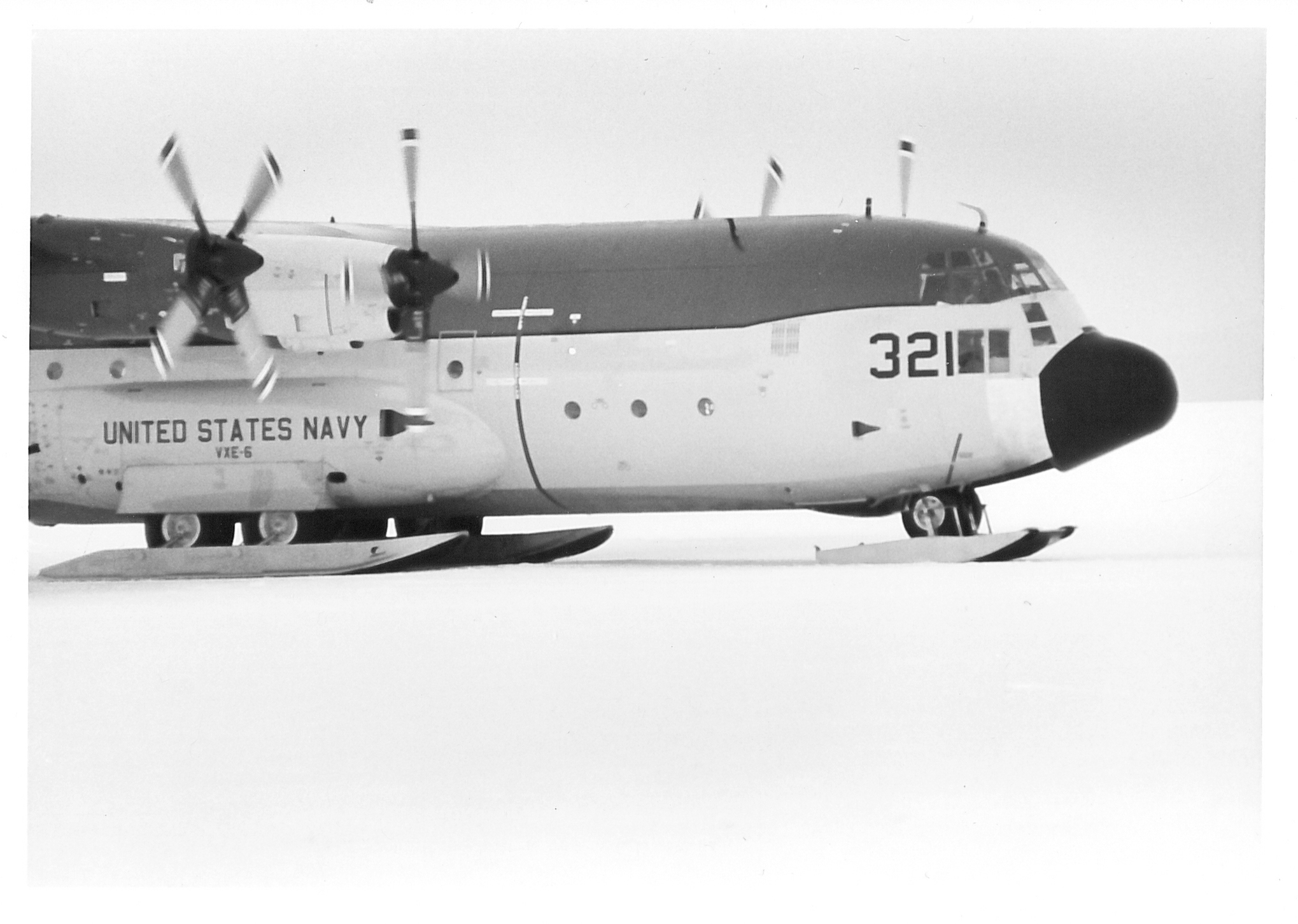 An airplane on a snow-covered runway.