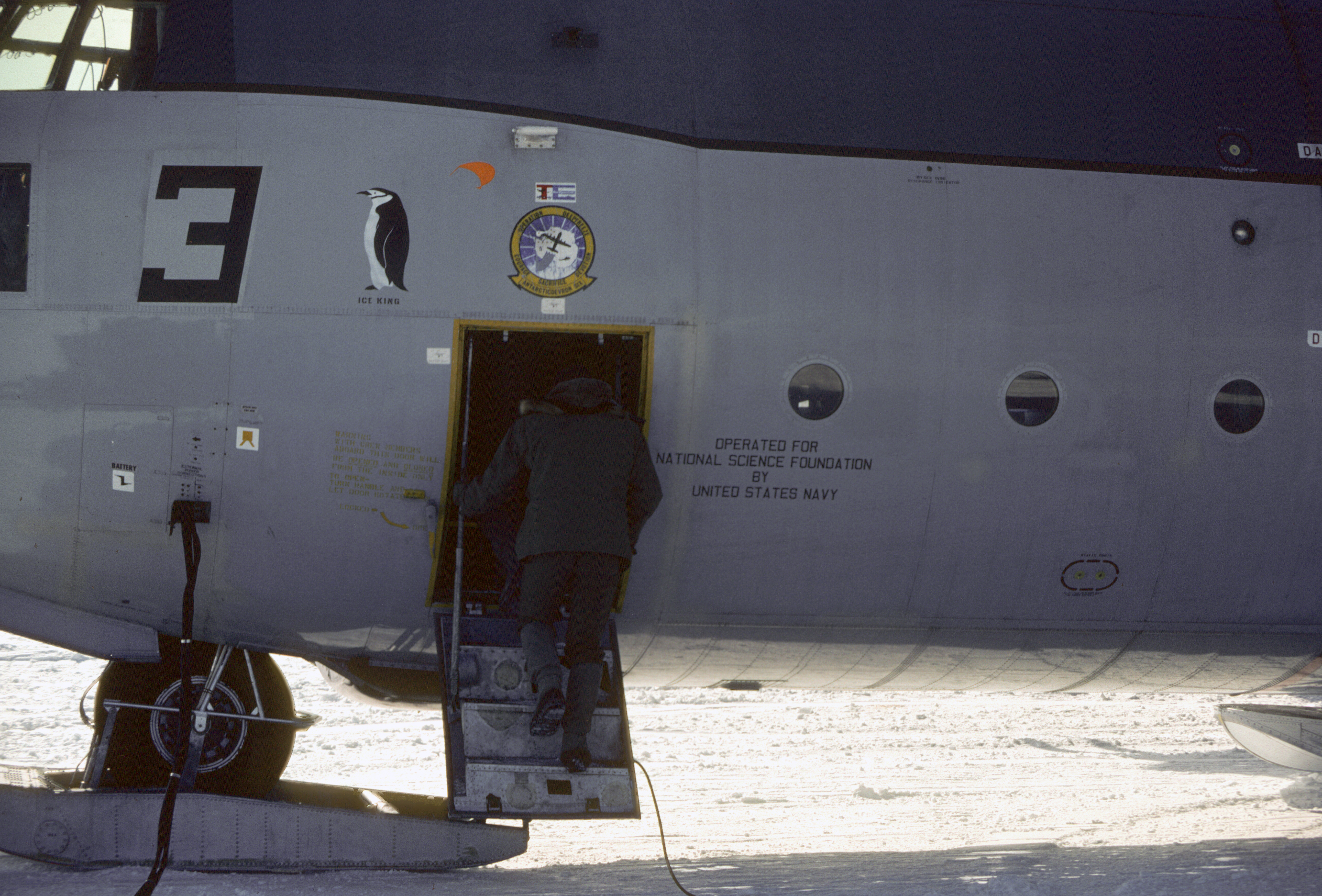 A person enters an airplane.