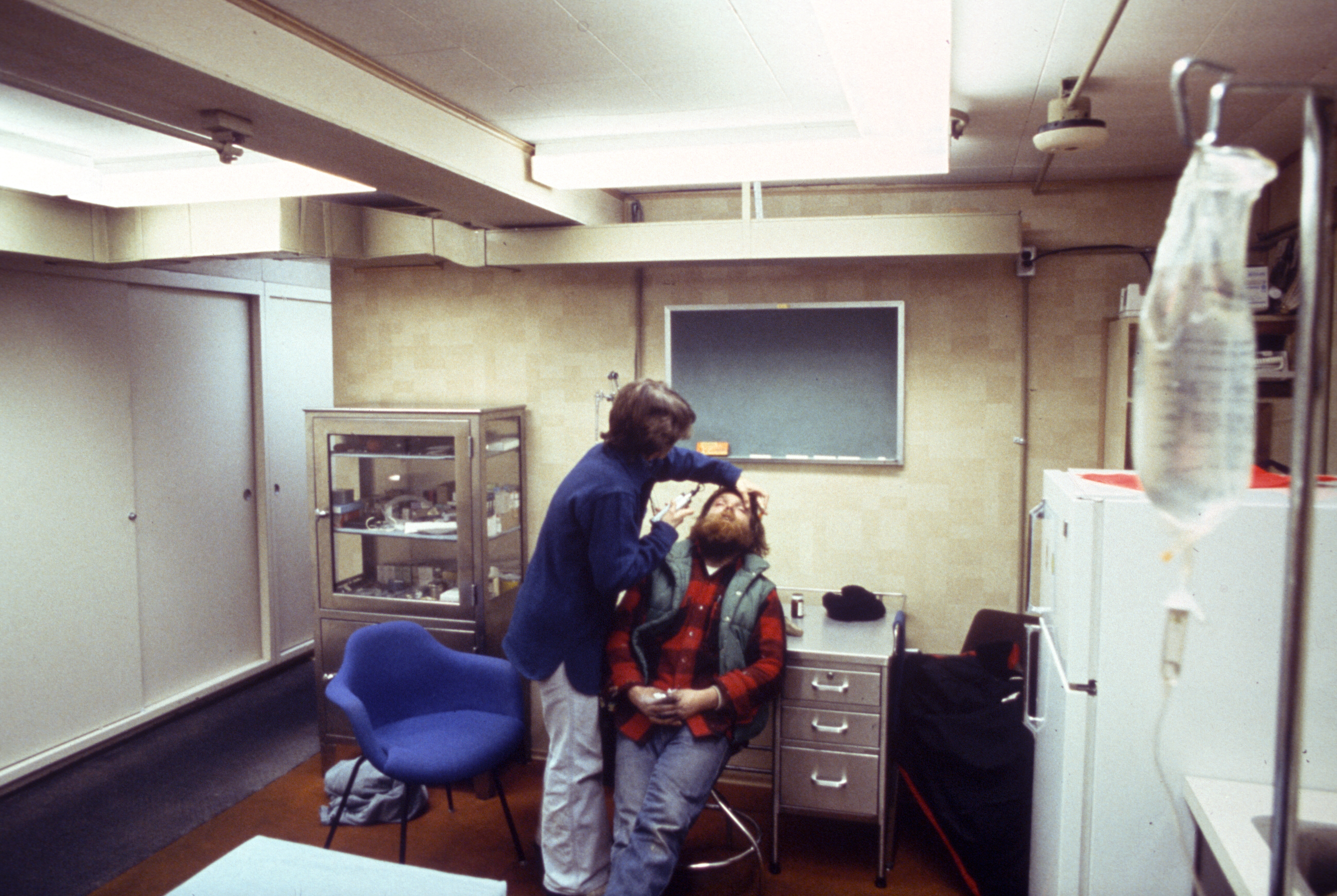 A doctor examines a patient.