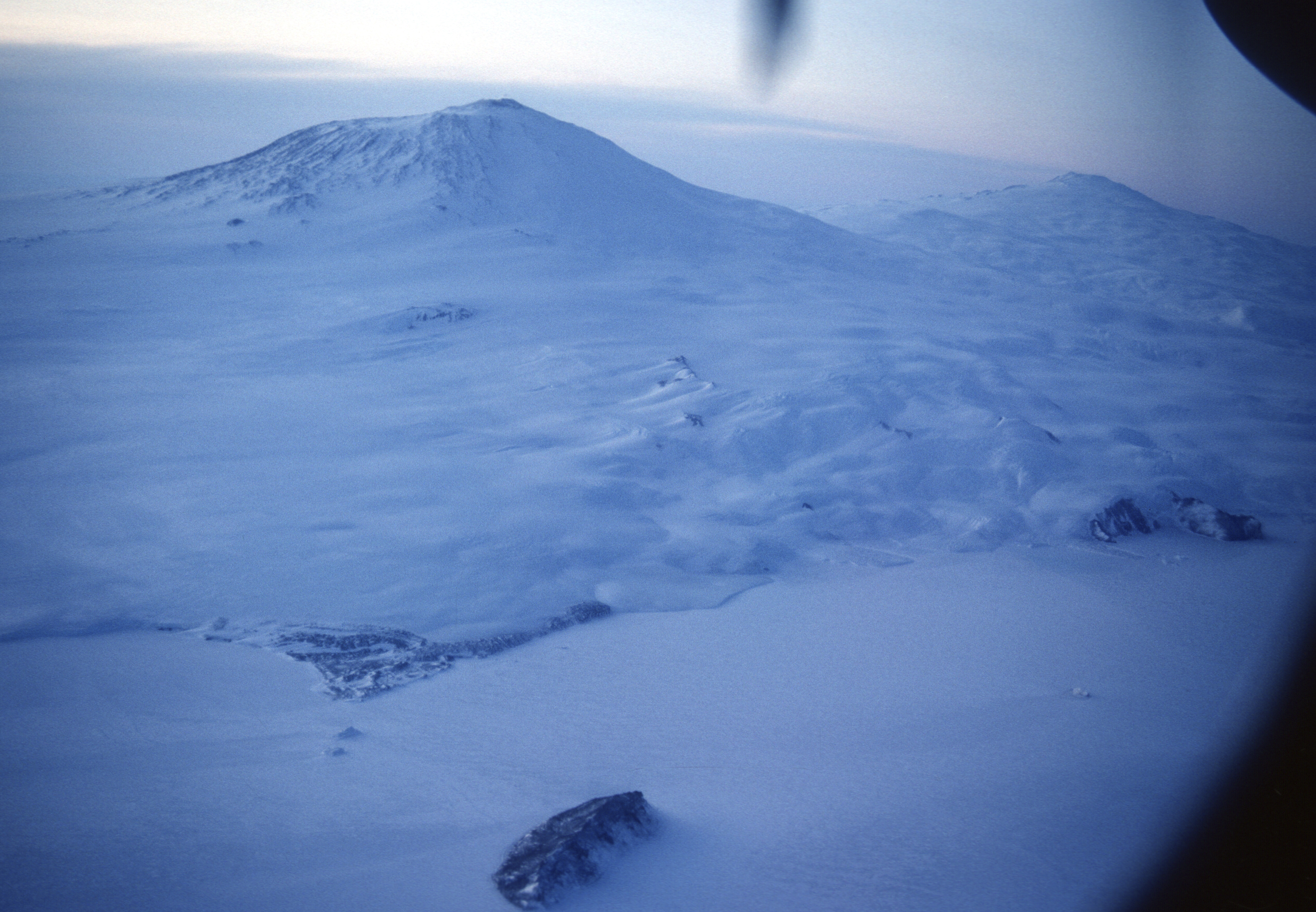 Aerial view of a snow-covered mountain.
