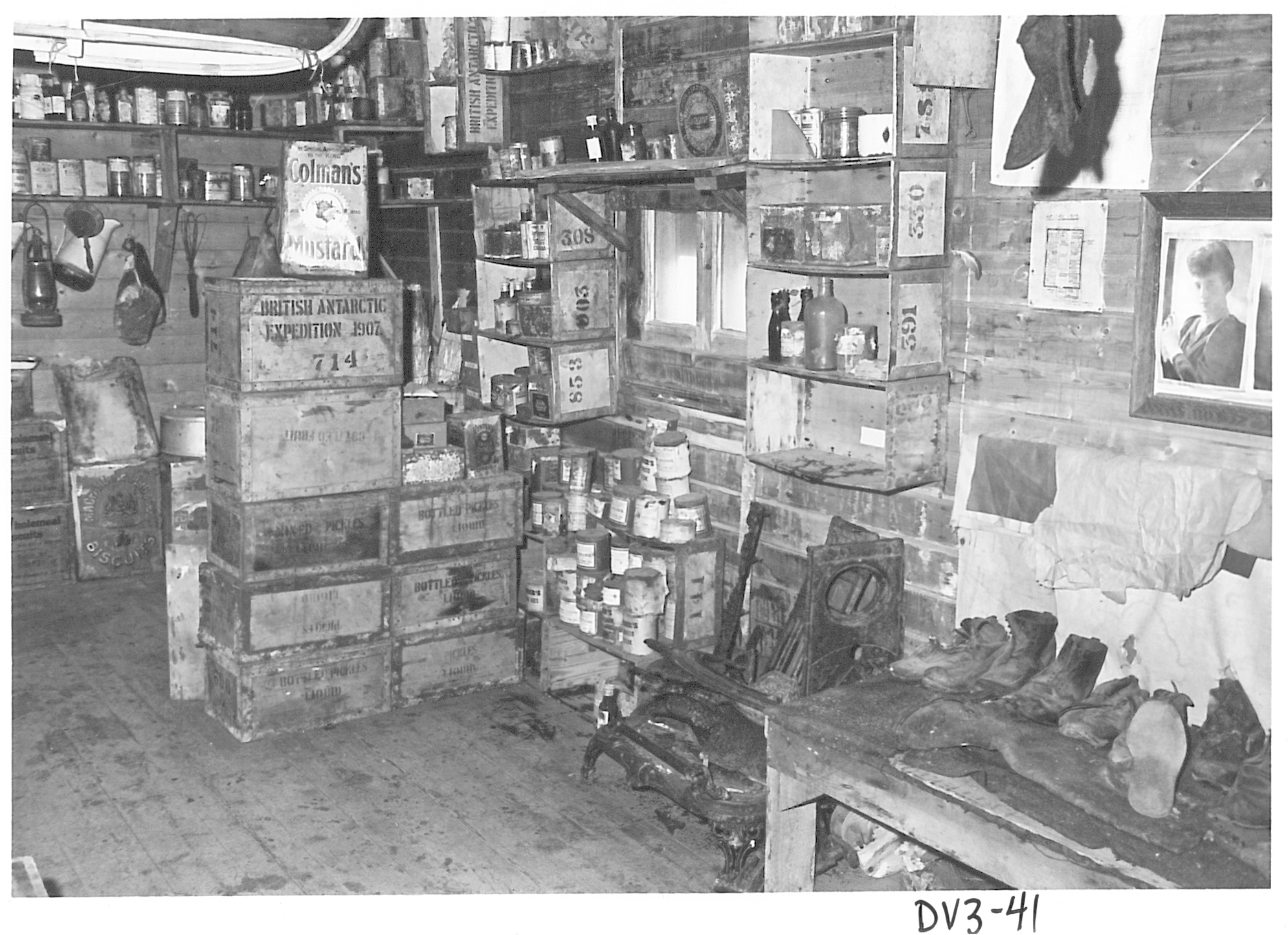 Boxes and supplies inside an old wooden building.