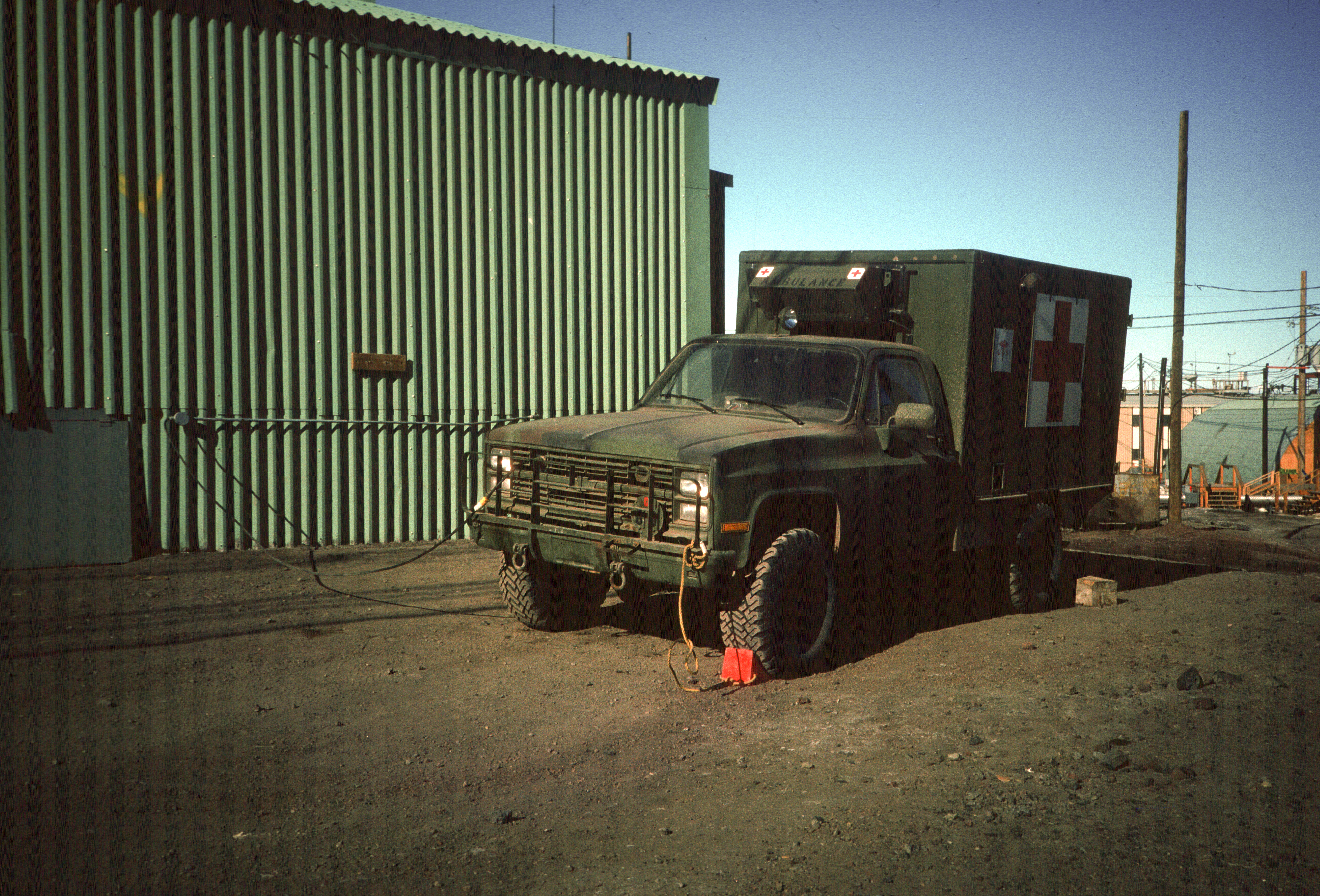 An old green military-style ambulance.