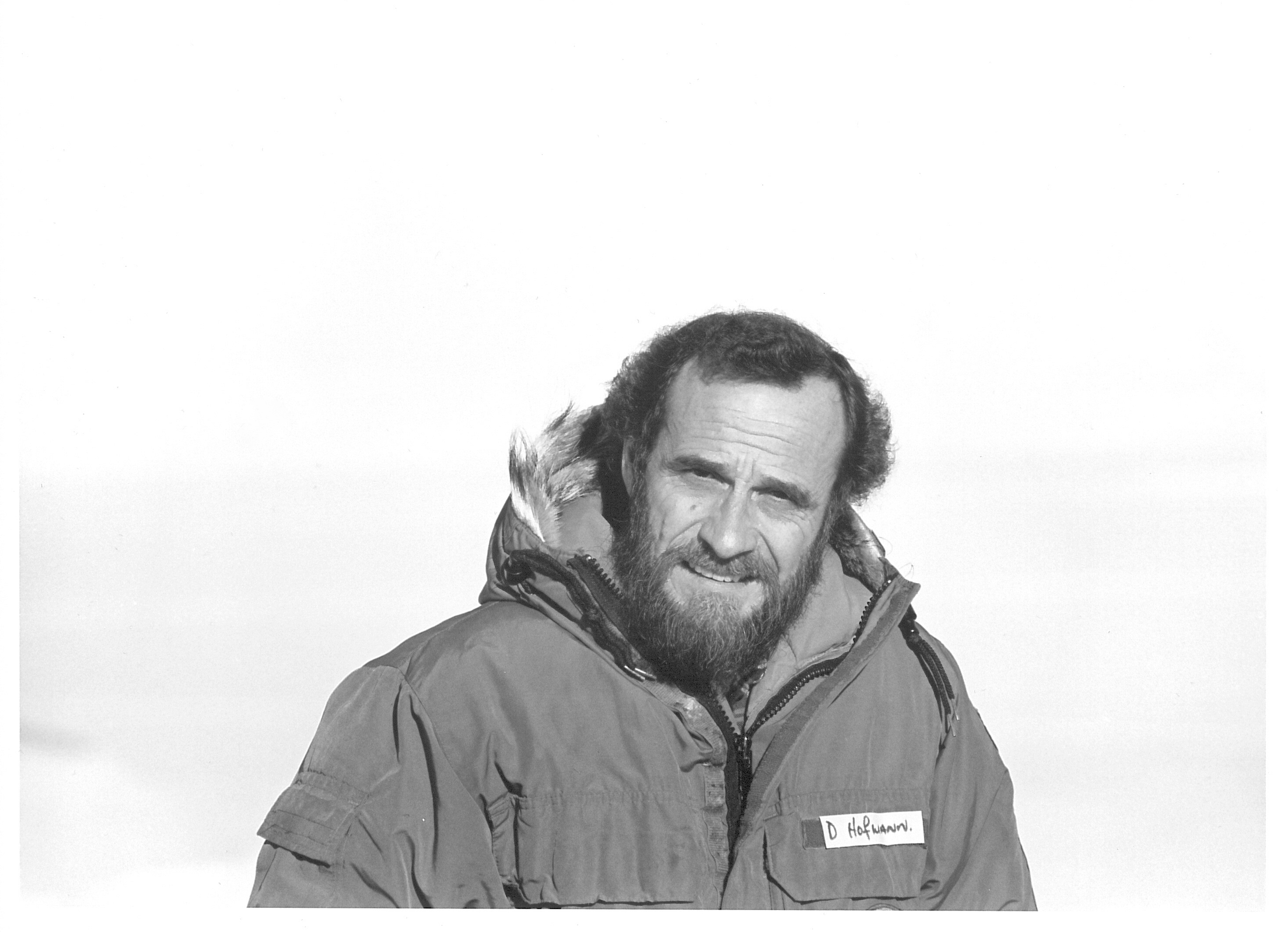 A portrait of a man wearing a parka.