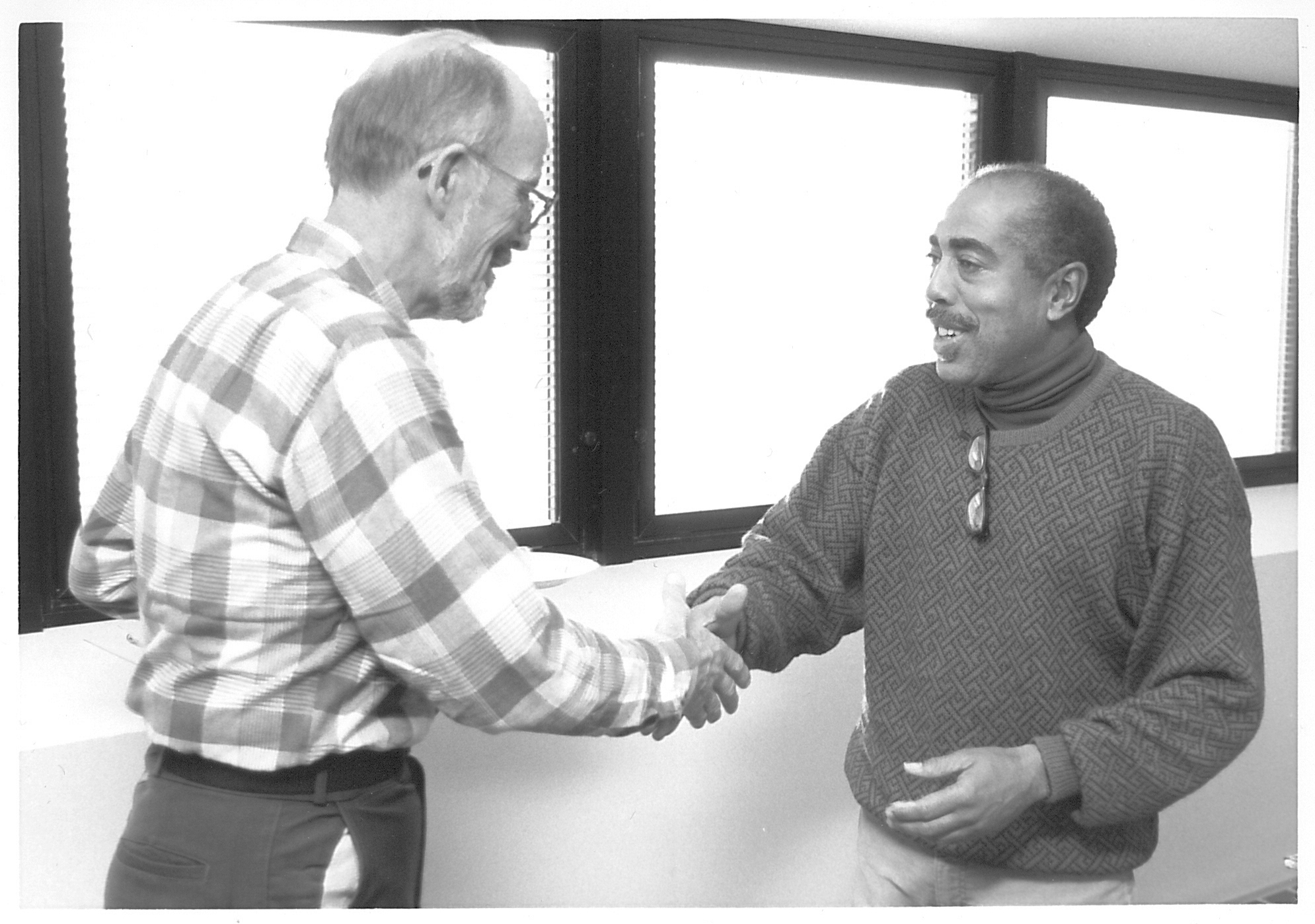 Two men shaking hands.