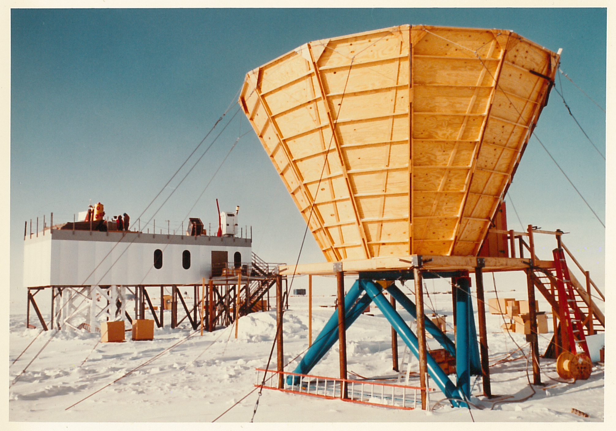 A cone-shaped structure and an elevated building behind it.