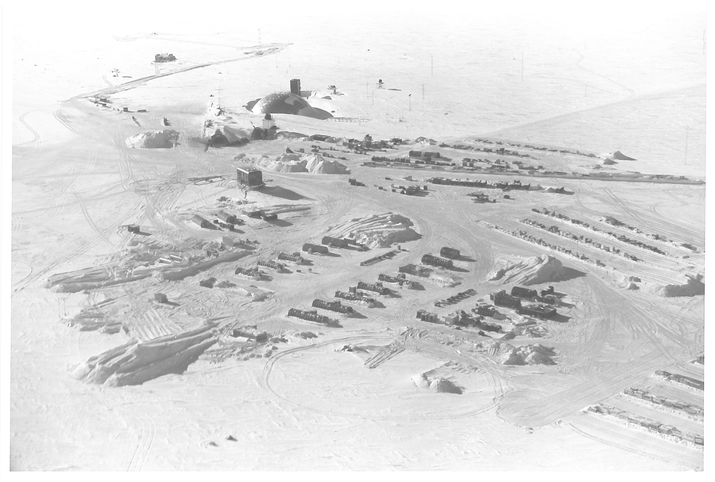 An aerial view of buildings in the snow.