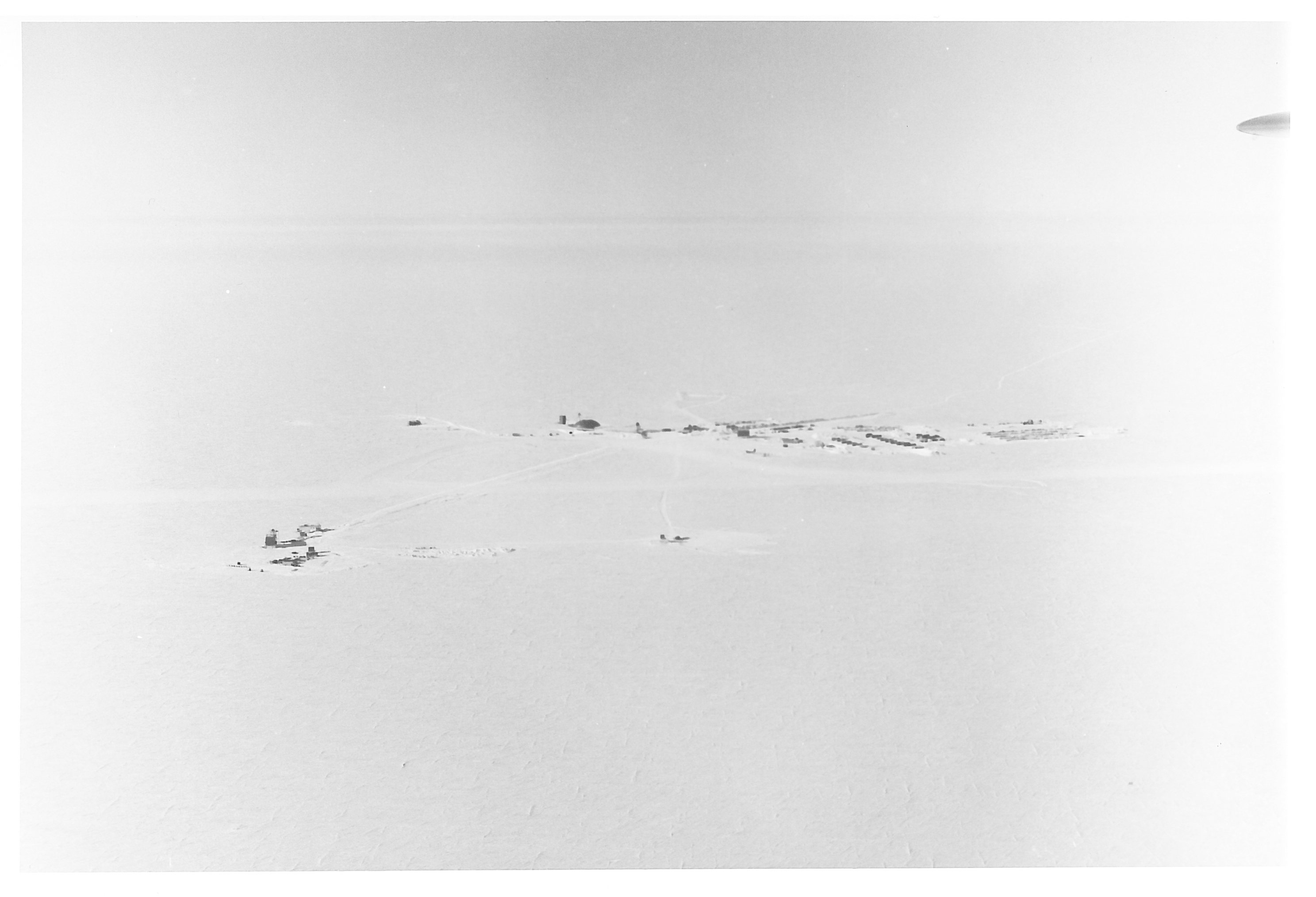 An aerial view of buildings in the snow.