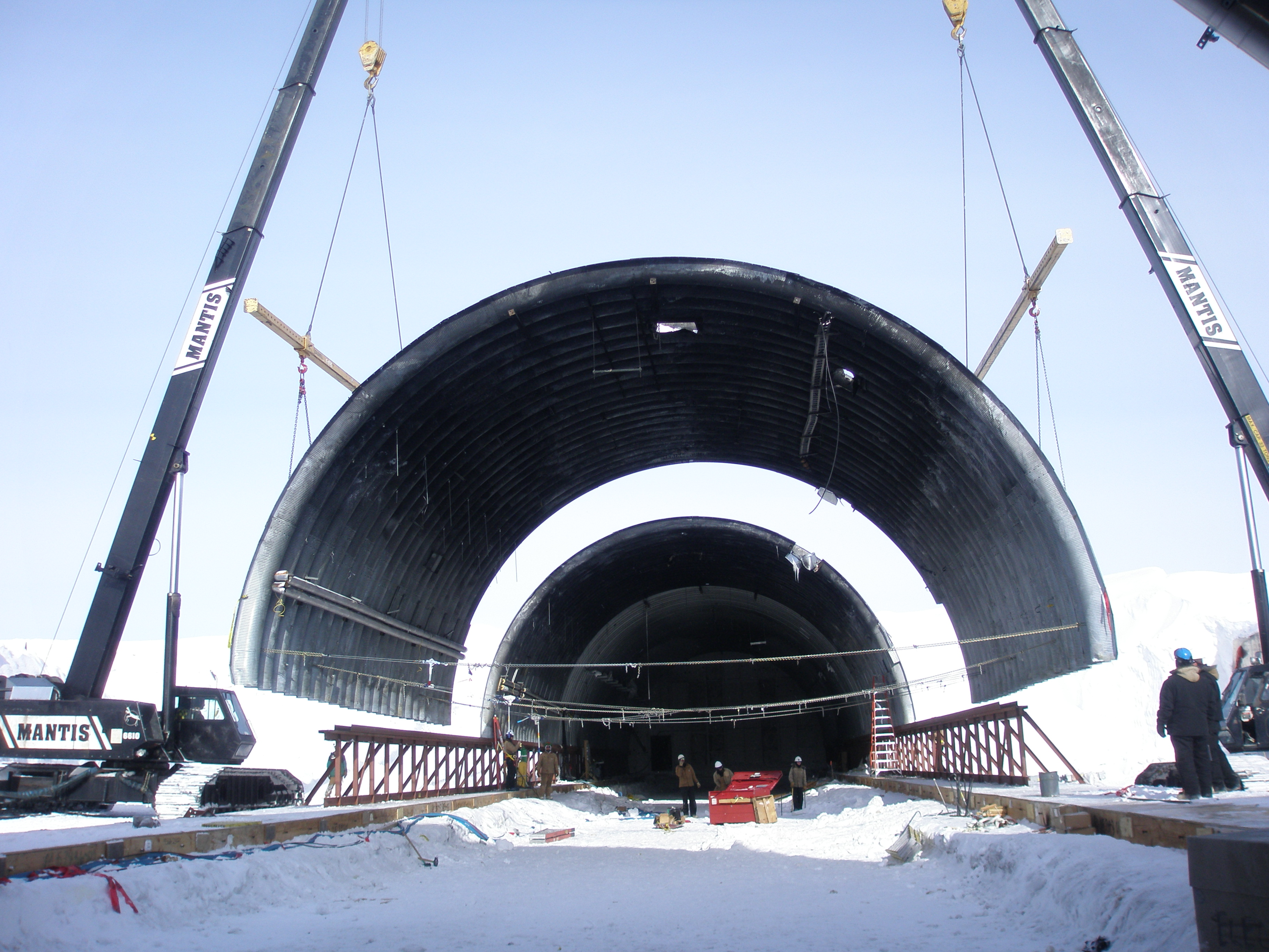 A section of an arch being lifted into place.