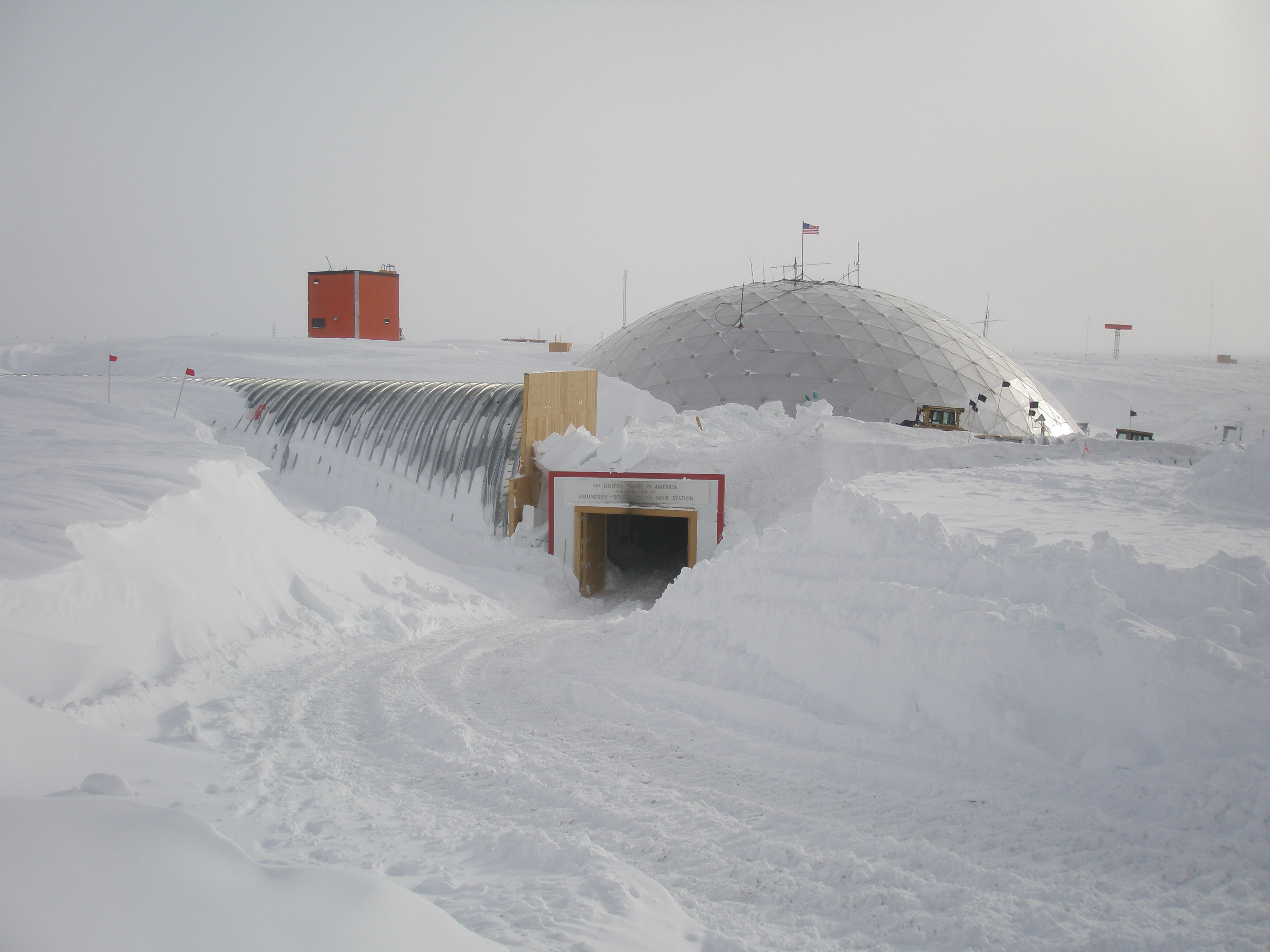 A dome and arch entry covered with snow.