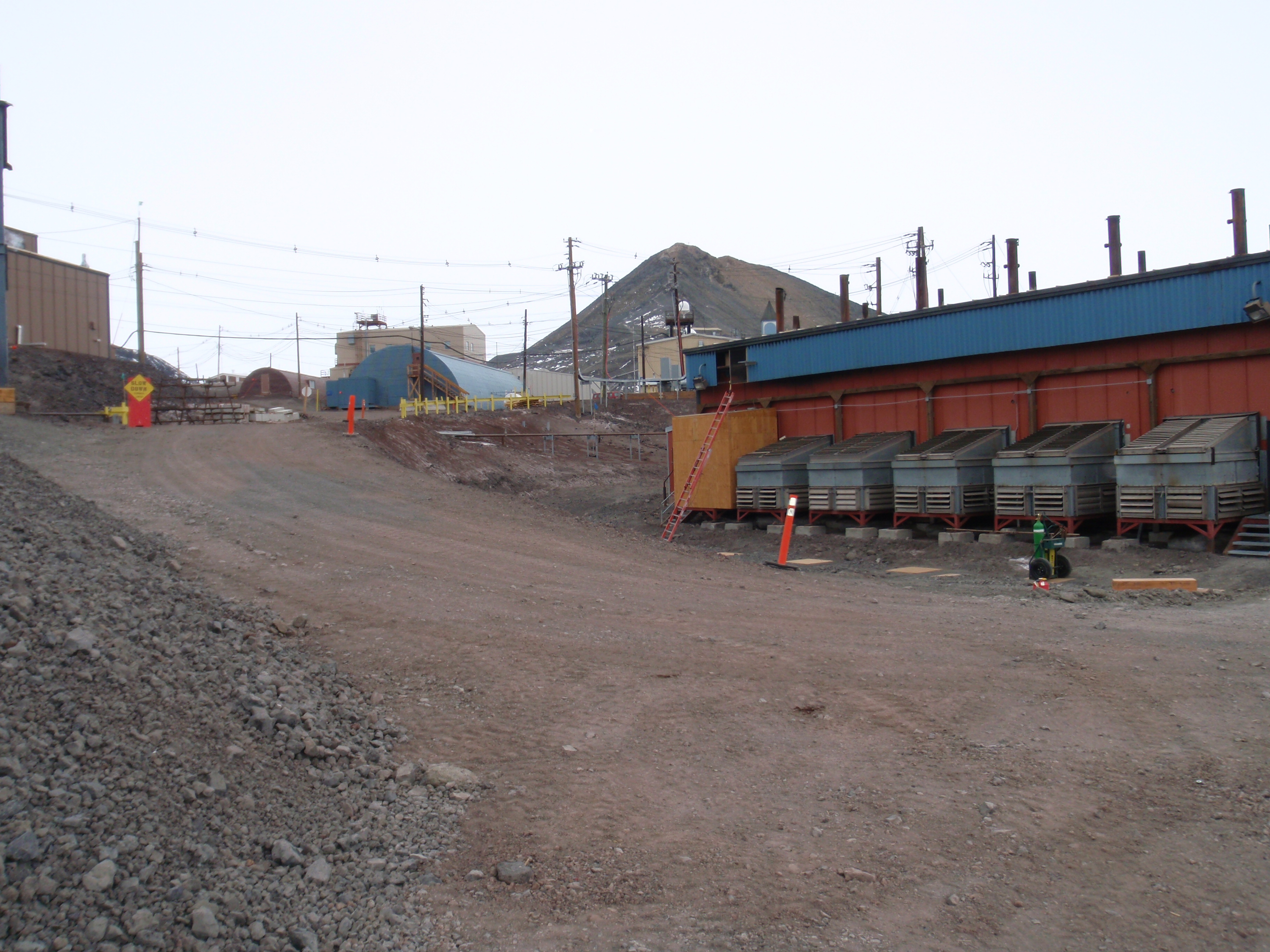 Buildings and a dirt road.