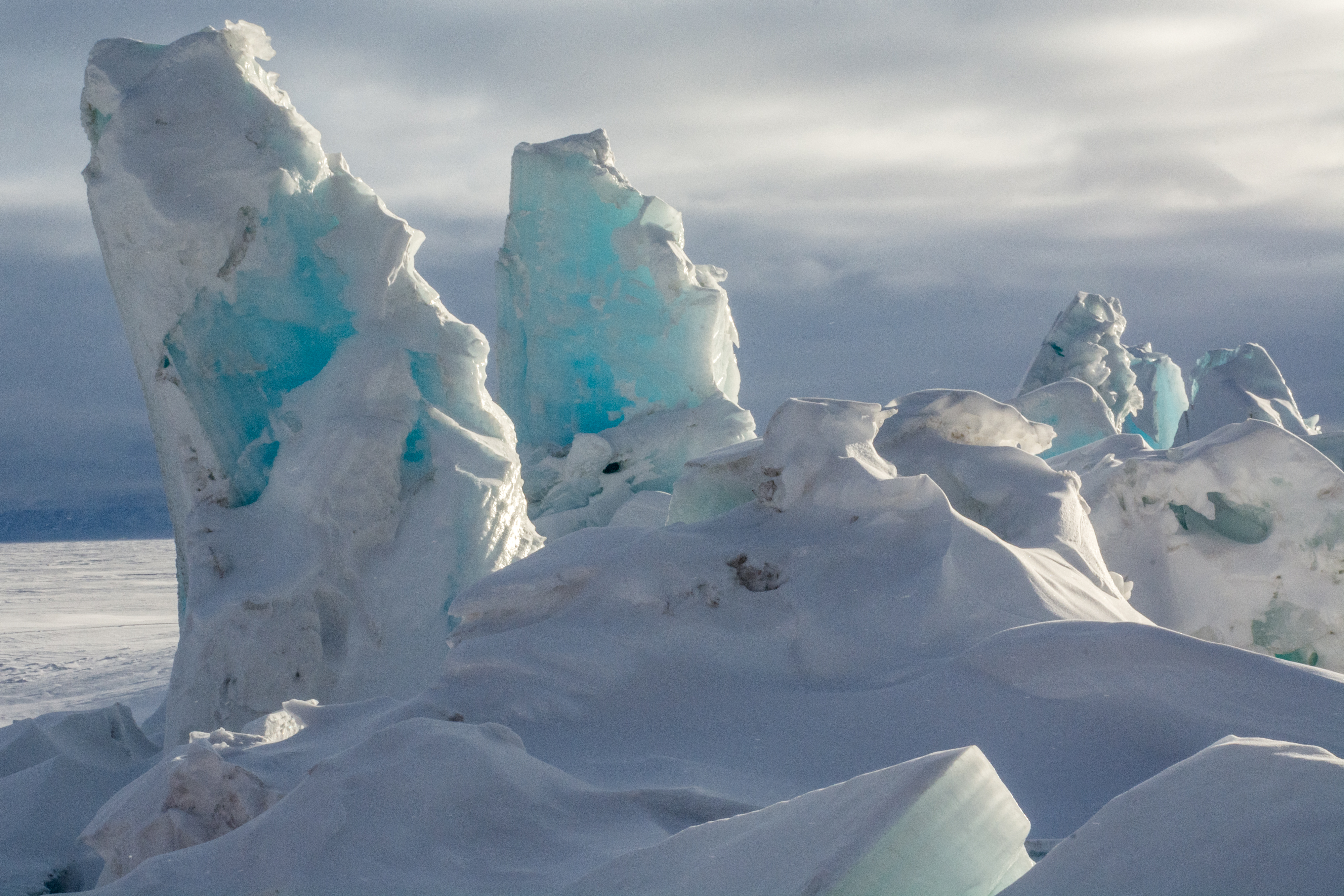 A landscape of snow and ice peaks.