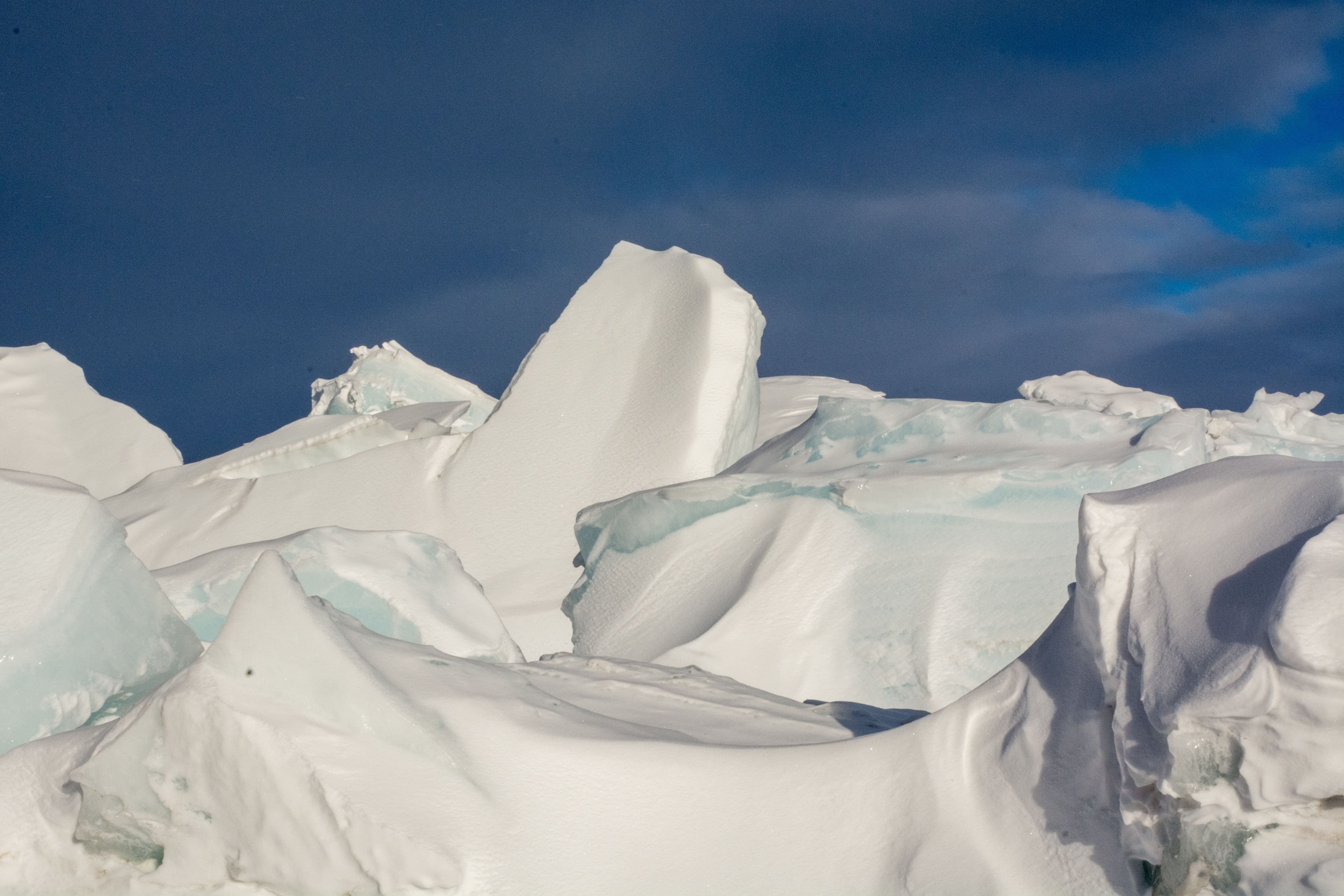 A landscape of snow and ice peaks.