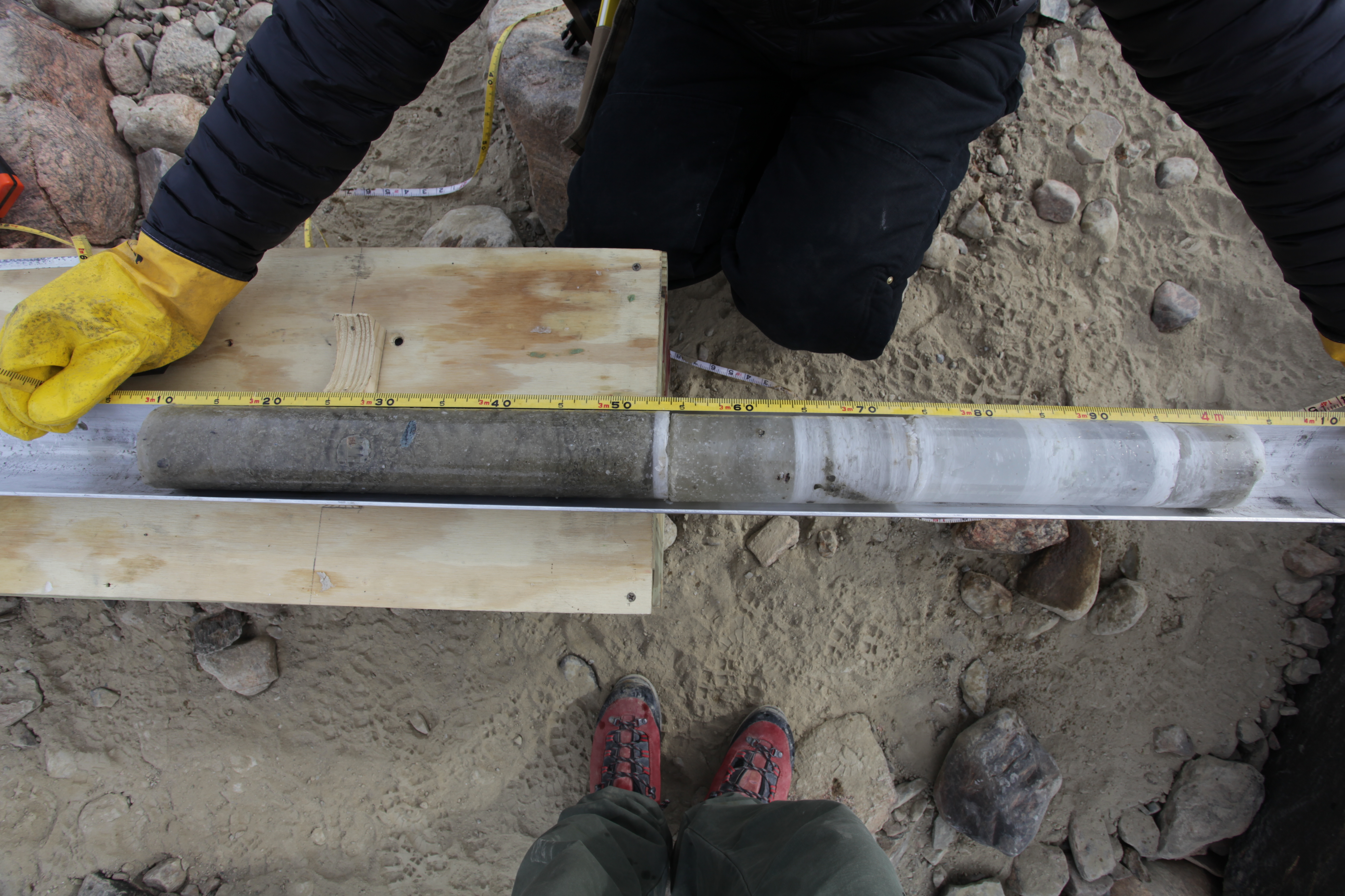 A person holding an ice core sample.