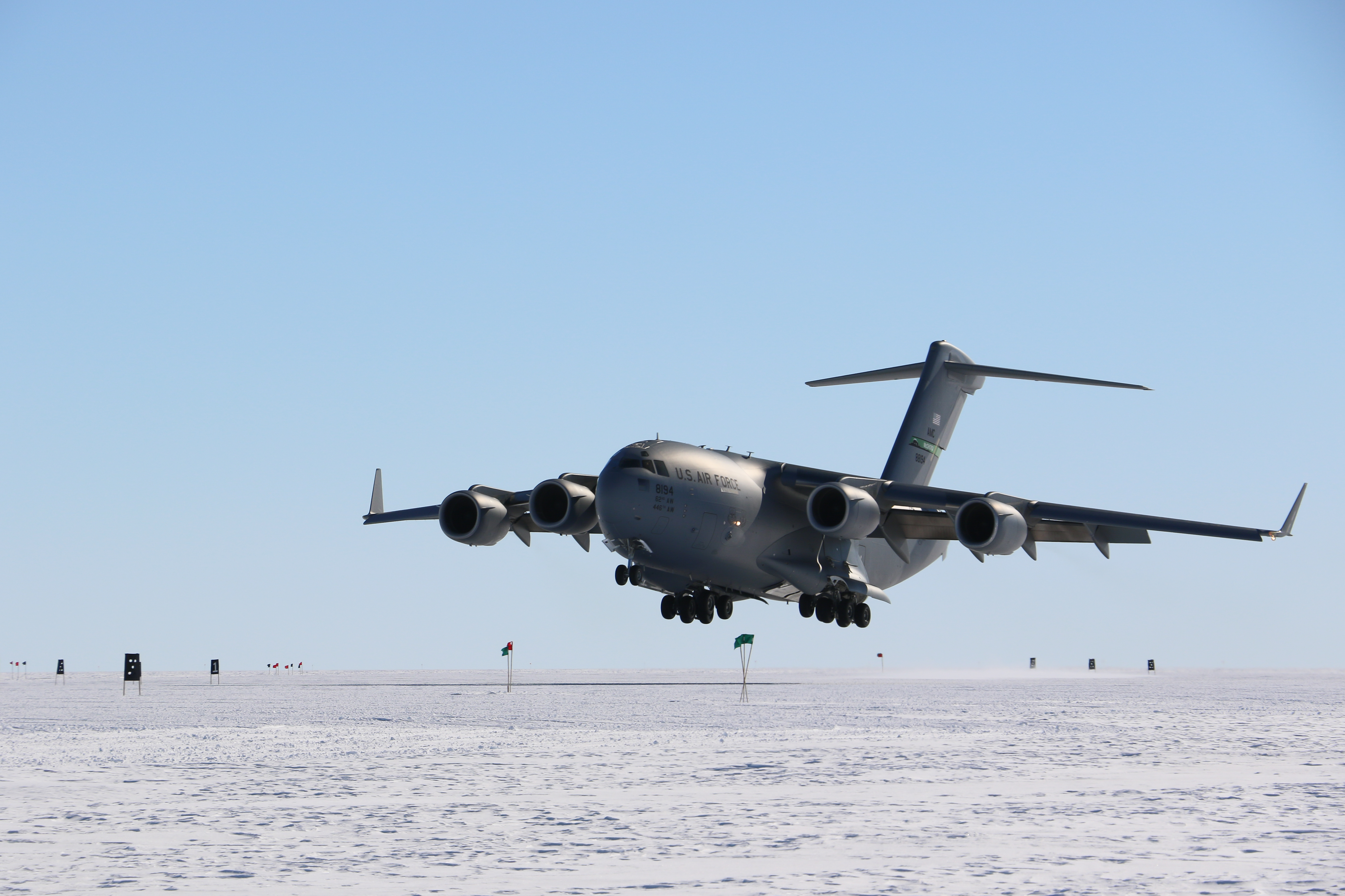 A jet landing on a frozen runway.