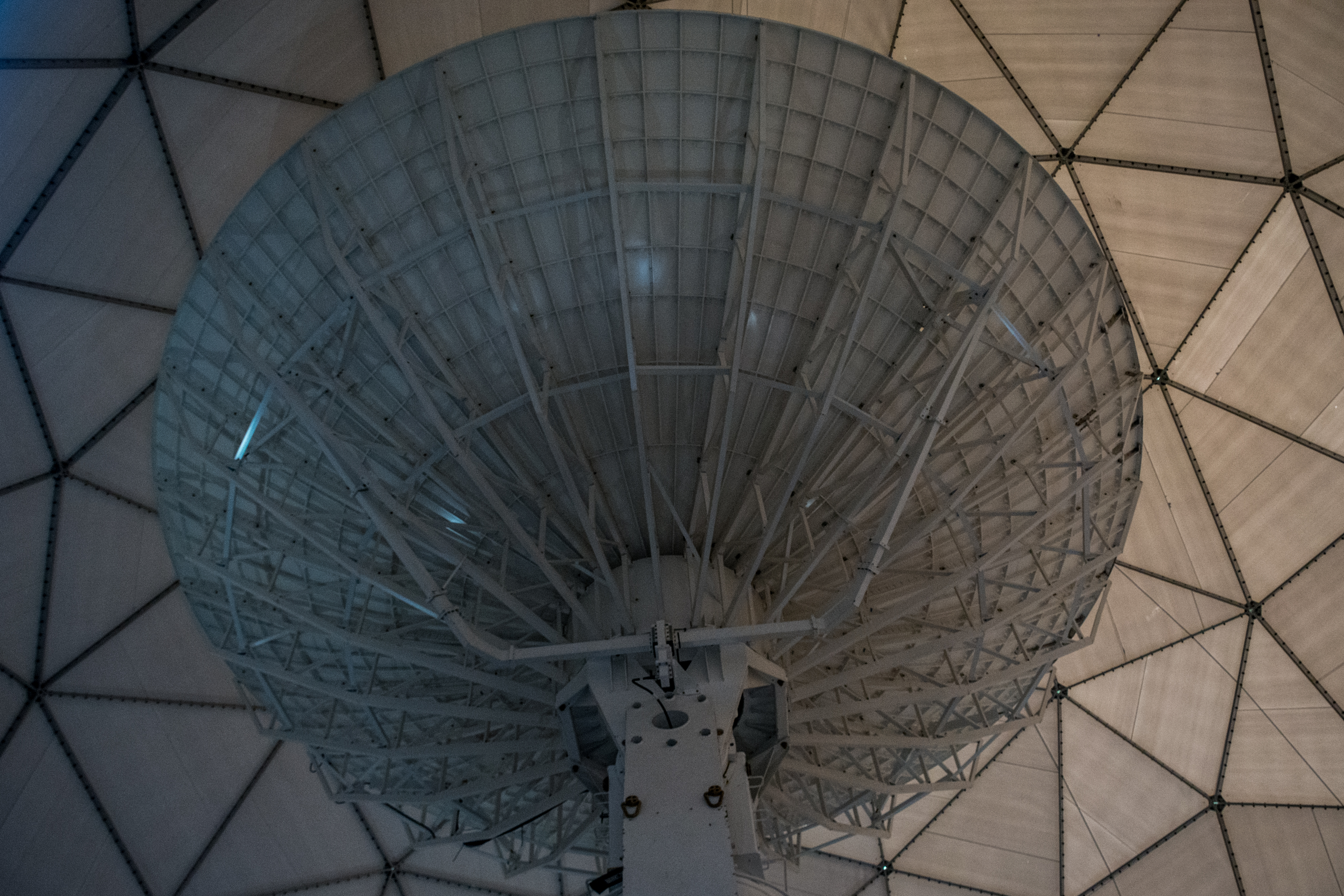 A satellite dish as seen from below.