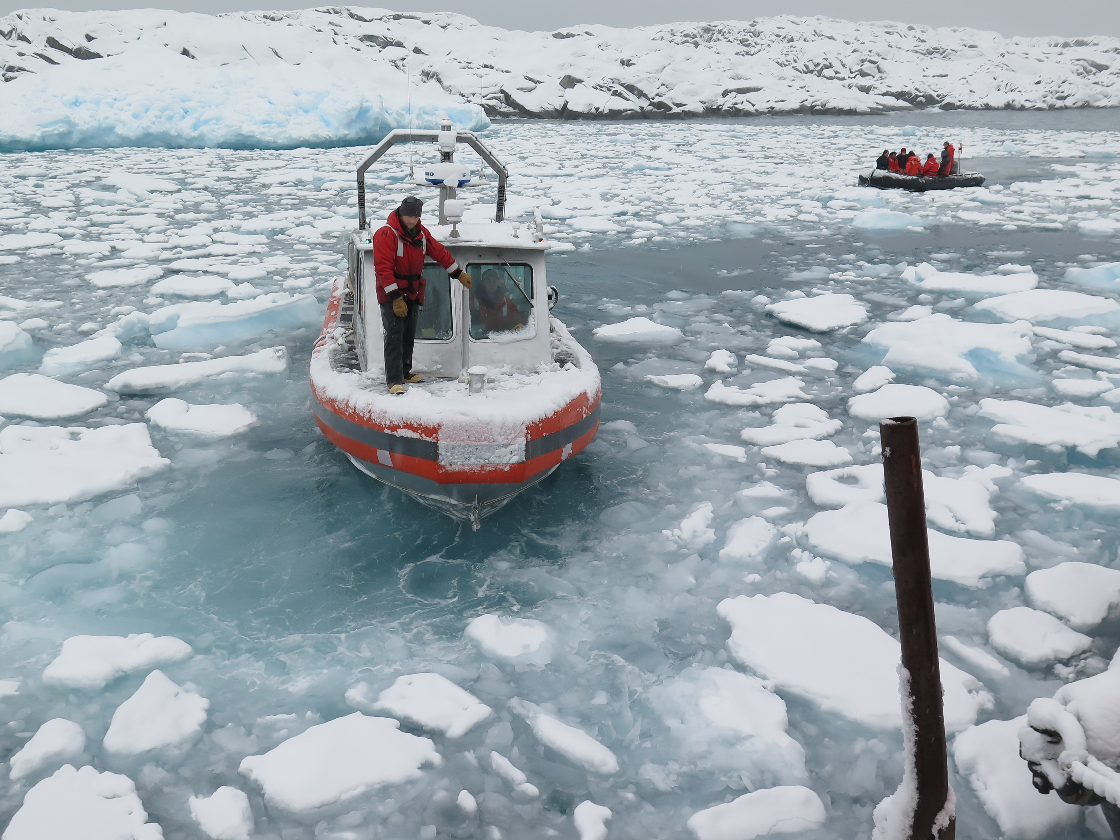 Boat approaching the pier in icy water