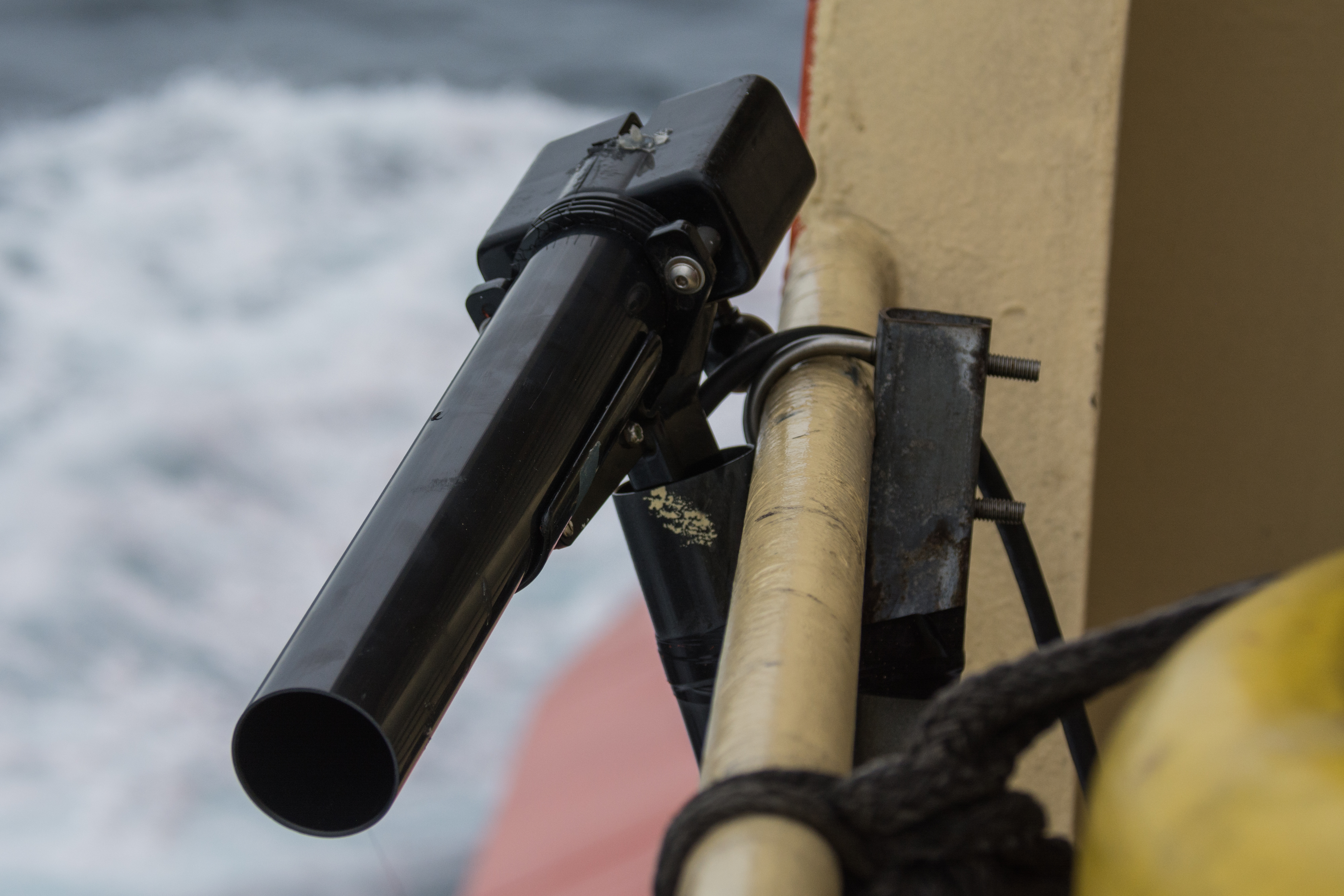 A scientific instrument attached to the side of a ship.