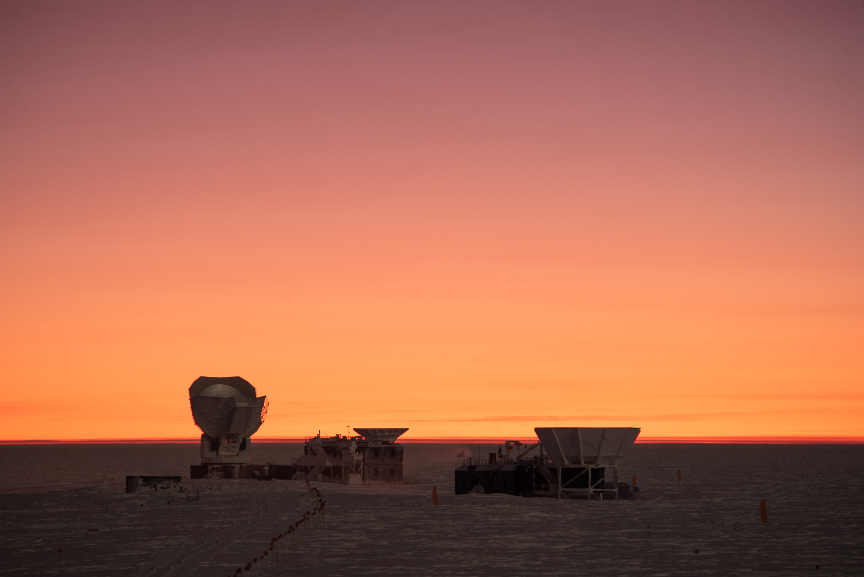 Two telescopes at sunrise.