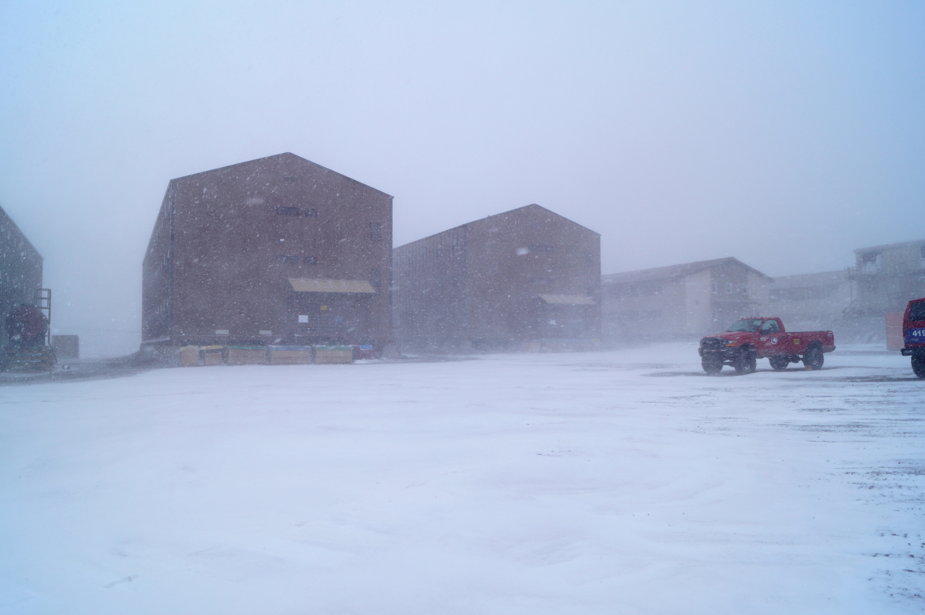 Several buildings in a snow storm.