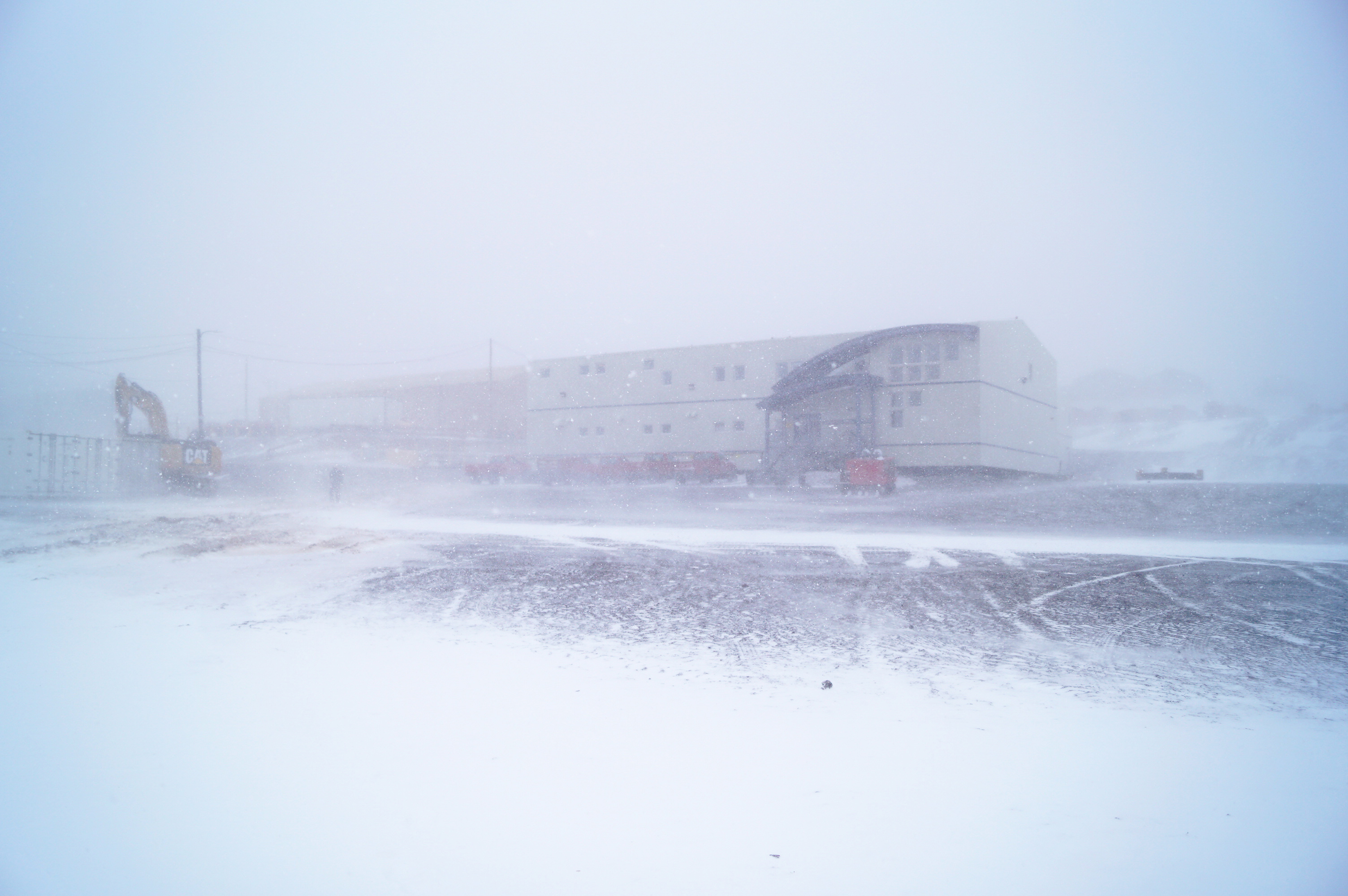 The exterior of a building during a snow storm.