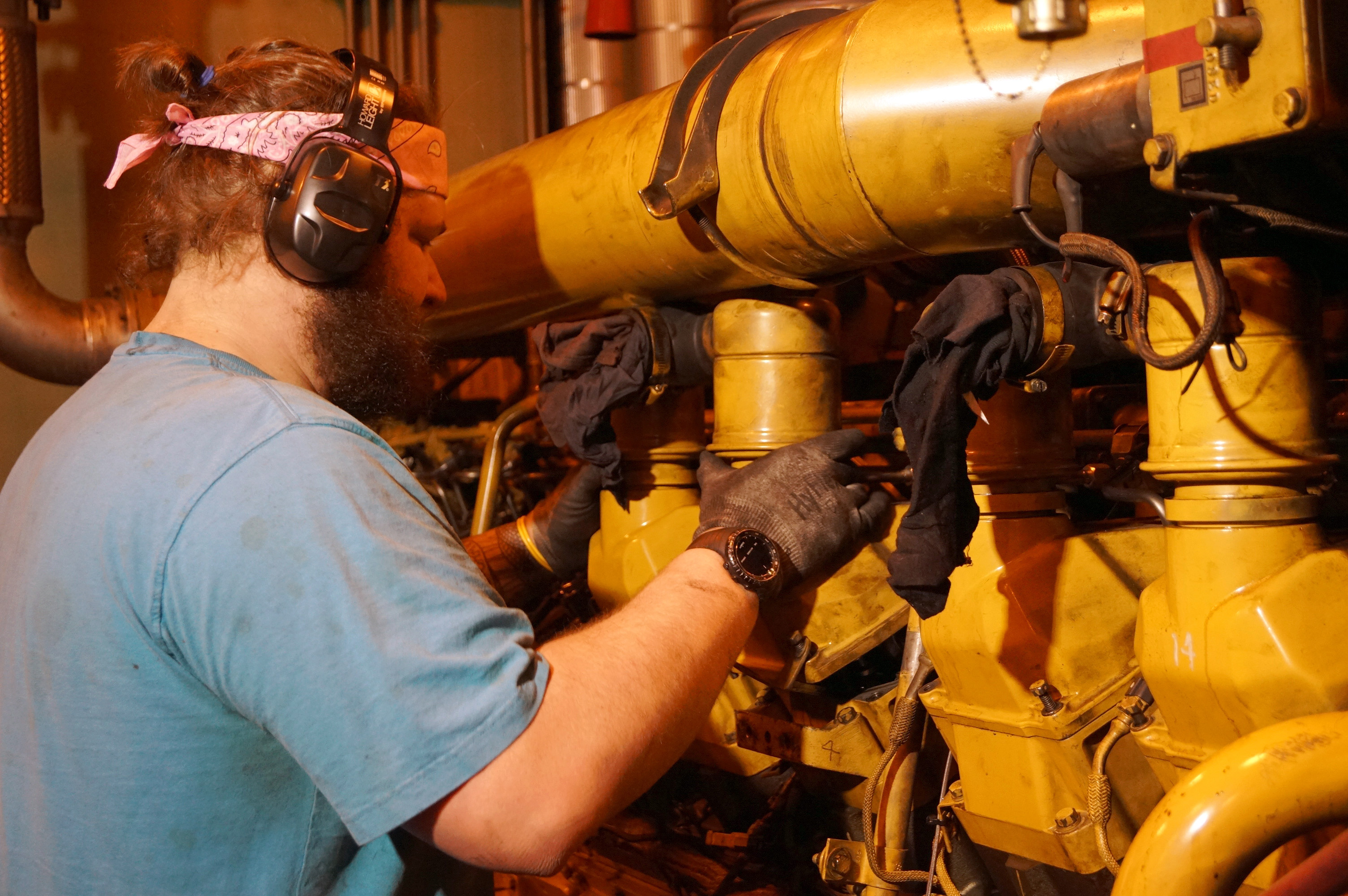 A mechanic works on power plant generators.