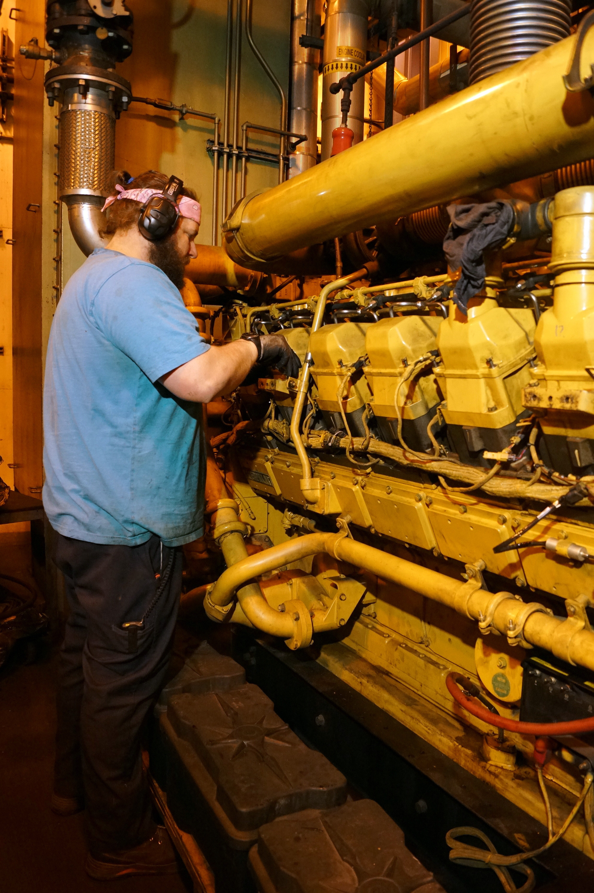 A mechanic works on power plant generators.