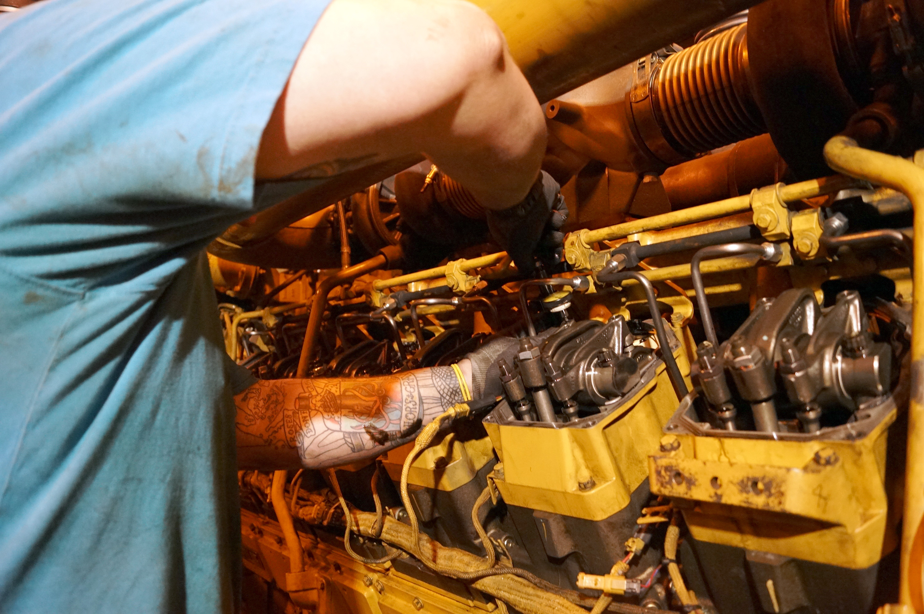 A mechanic works on power plant generators.